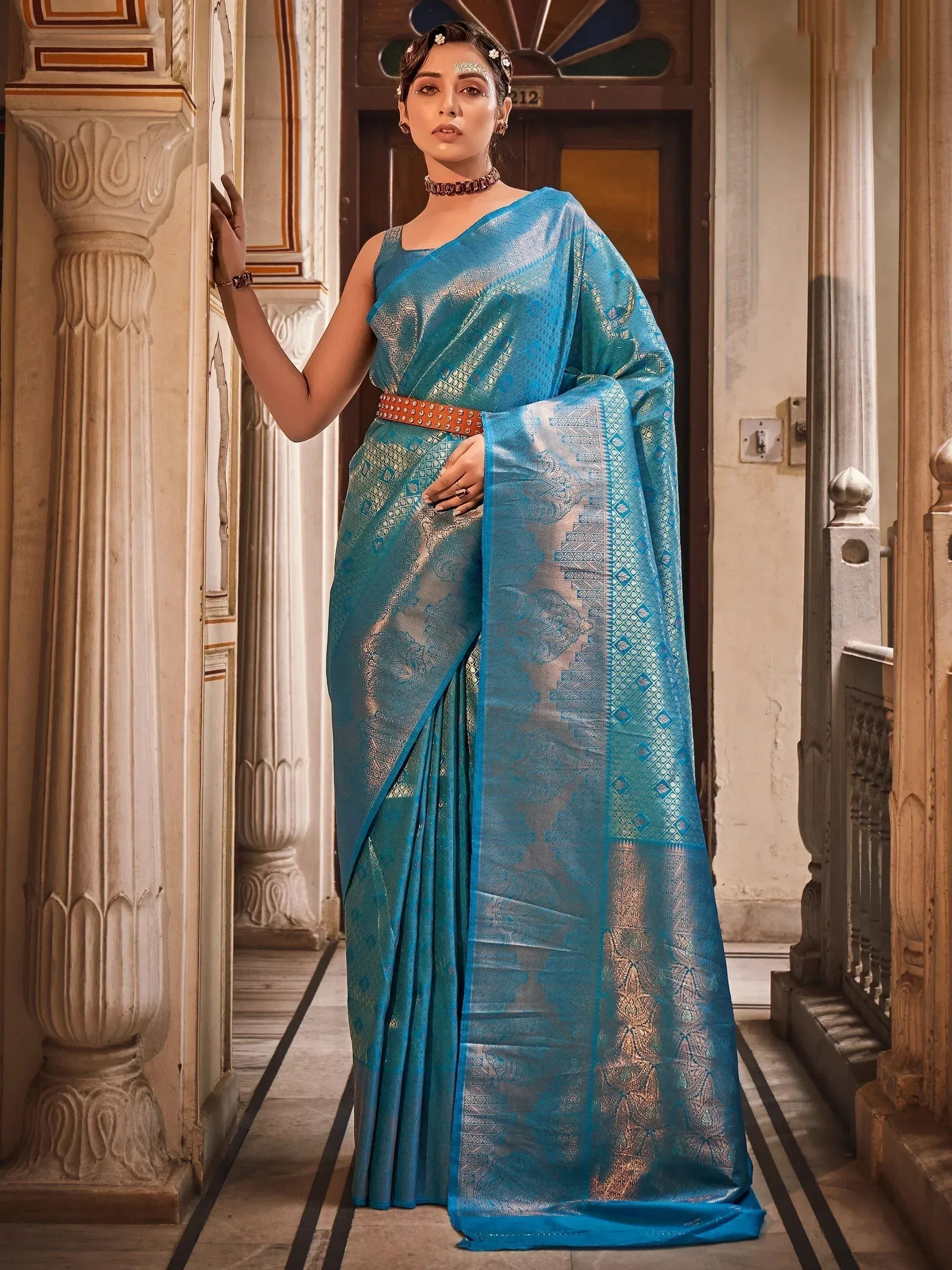 Elegant blue designer saree with gold zari work, perfect for Indian ethnic occasions