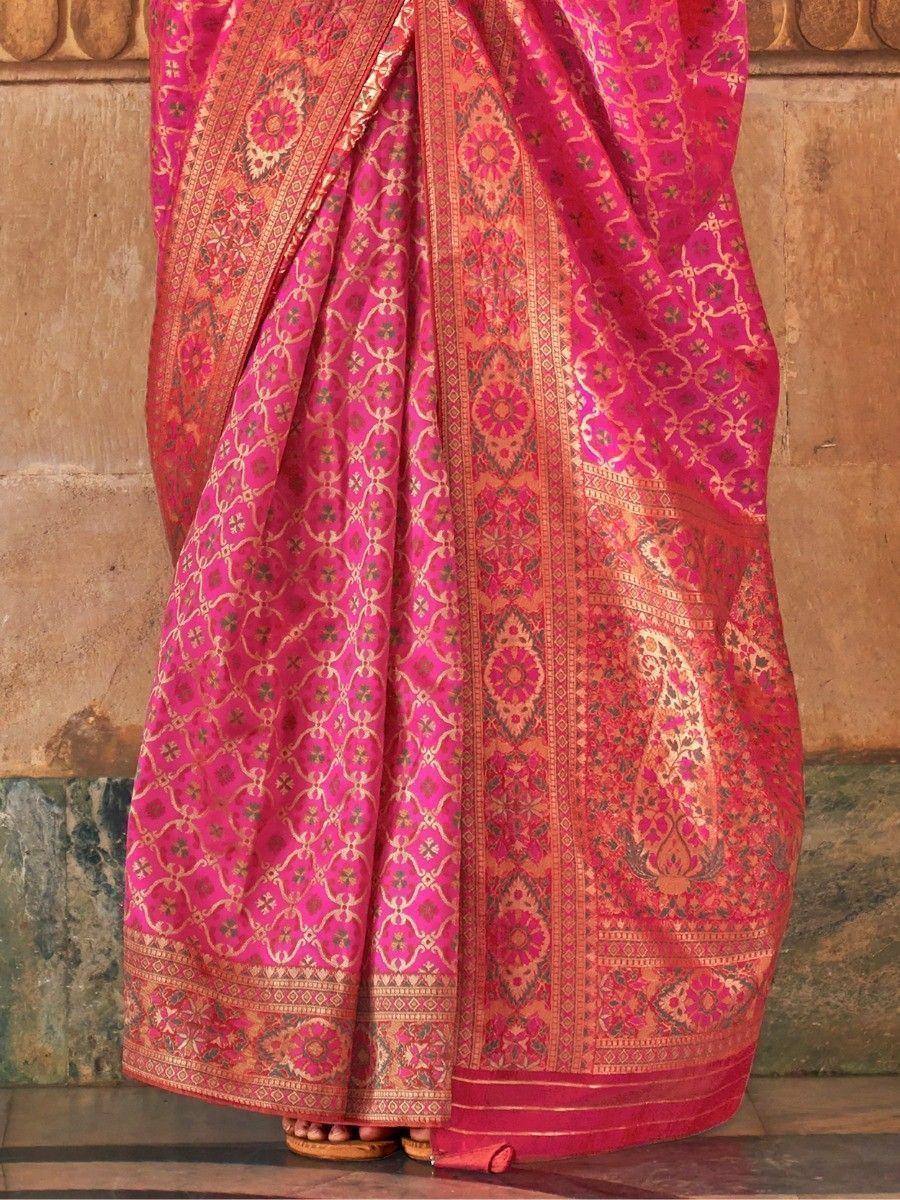 Pink designer saree with gold floral and geometric patterns, traditional Indian ethnic wear