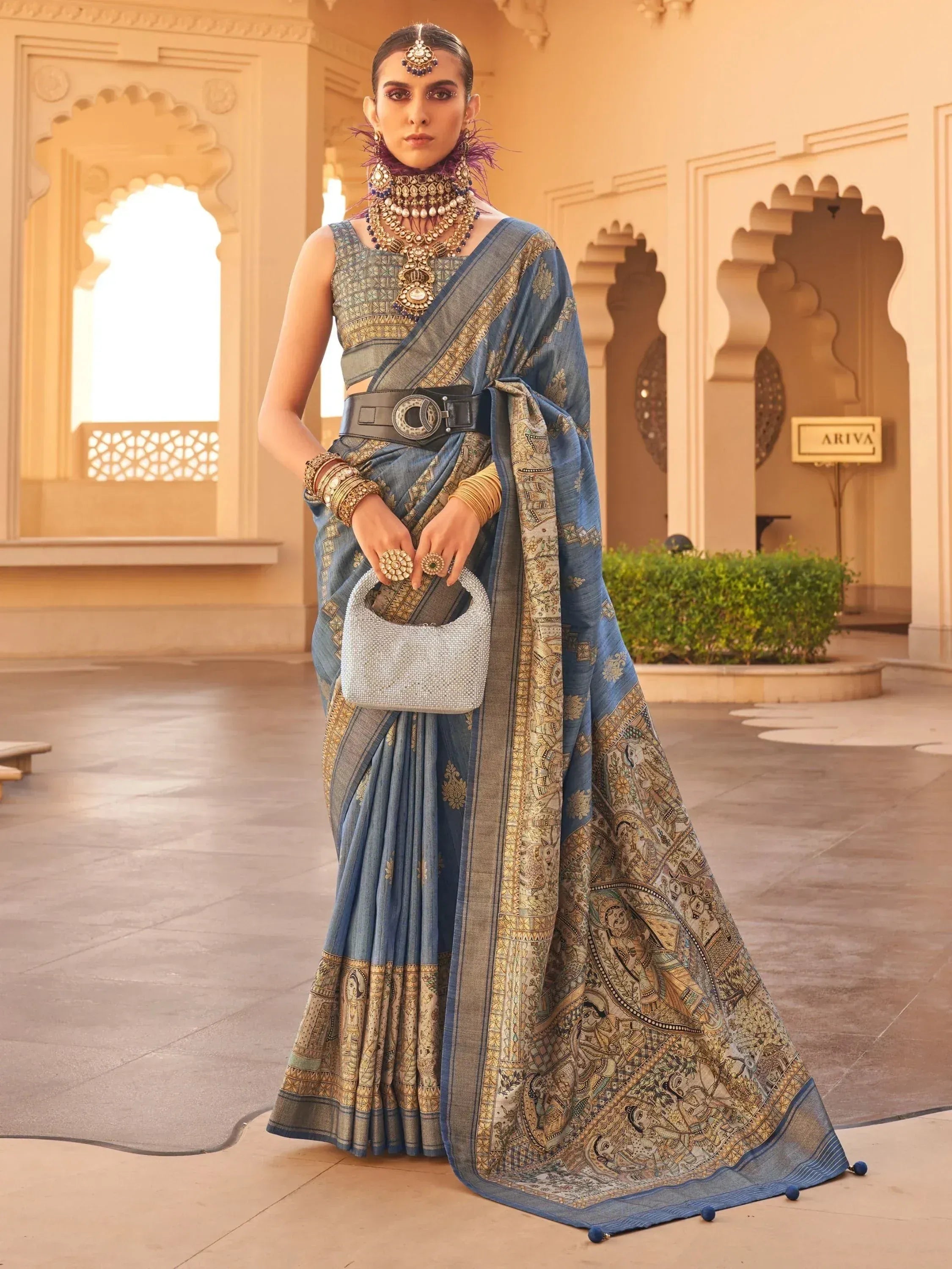 Blue printed saree with gold embroidery, traditional Indian ethnic wear, styled with statement jewelry and belt