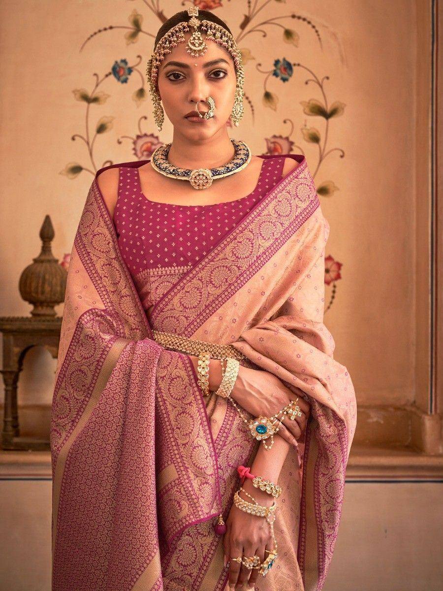 Elegant Indian saree with intricate embroidery, paired with traditional jewelry and maang tikka for festive occasions