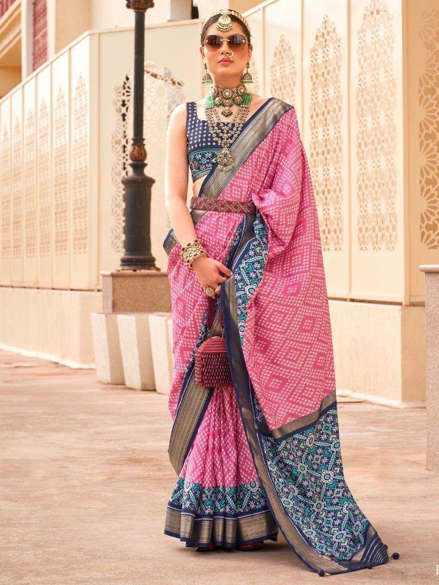 Pink and blue printed saree with ethnic jewelry, perfect for Indian festive occasions