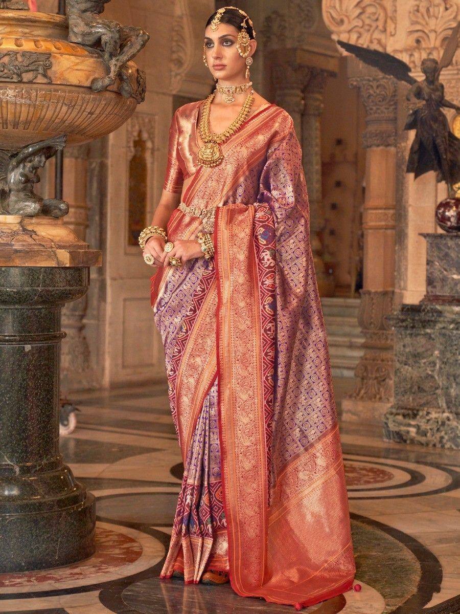 Elegant Indian saree in peach and purple with gold embroidery, paired with traditional jewelry for festive occasions