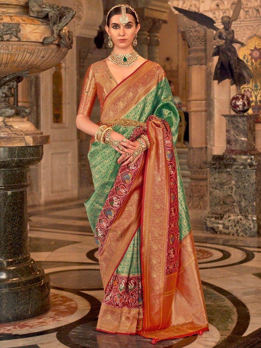 Elegant green and gold designer saree with intricate embroidery, perfect for Indian ethnic occasions