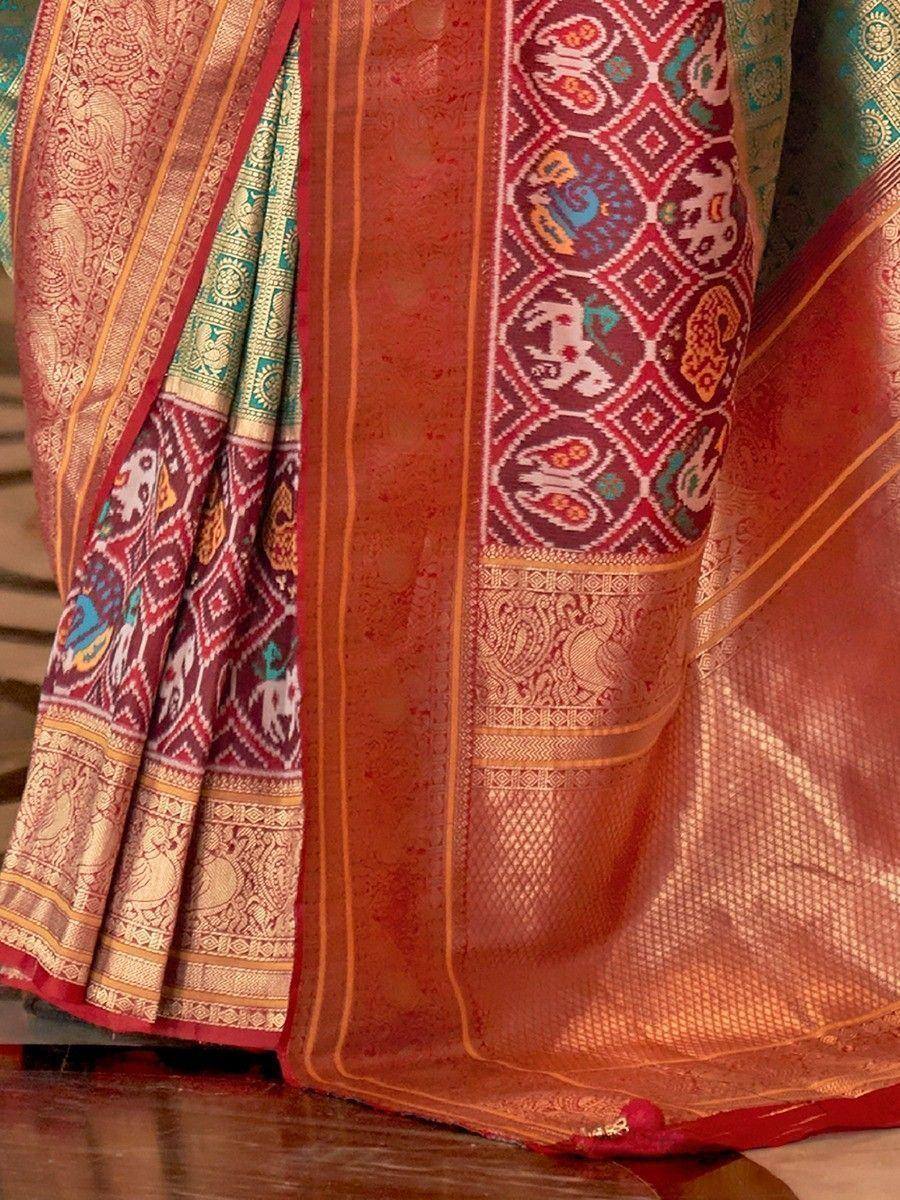 Richly embroidered Indian saree with elephant motifs, gold zari, and vibrant border patterns for ethnic wear