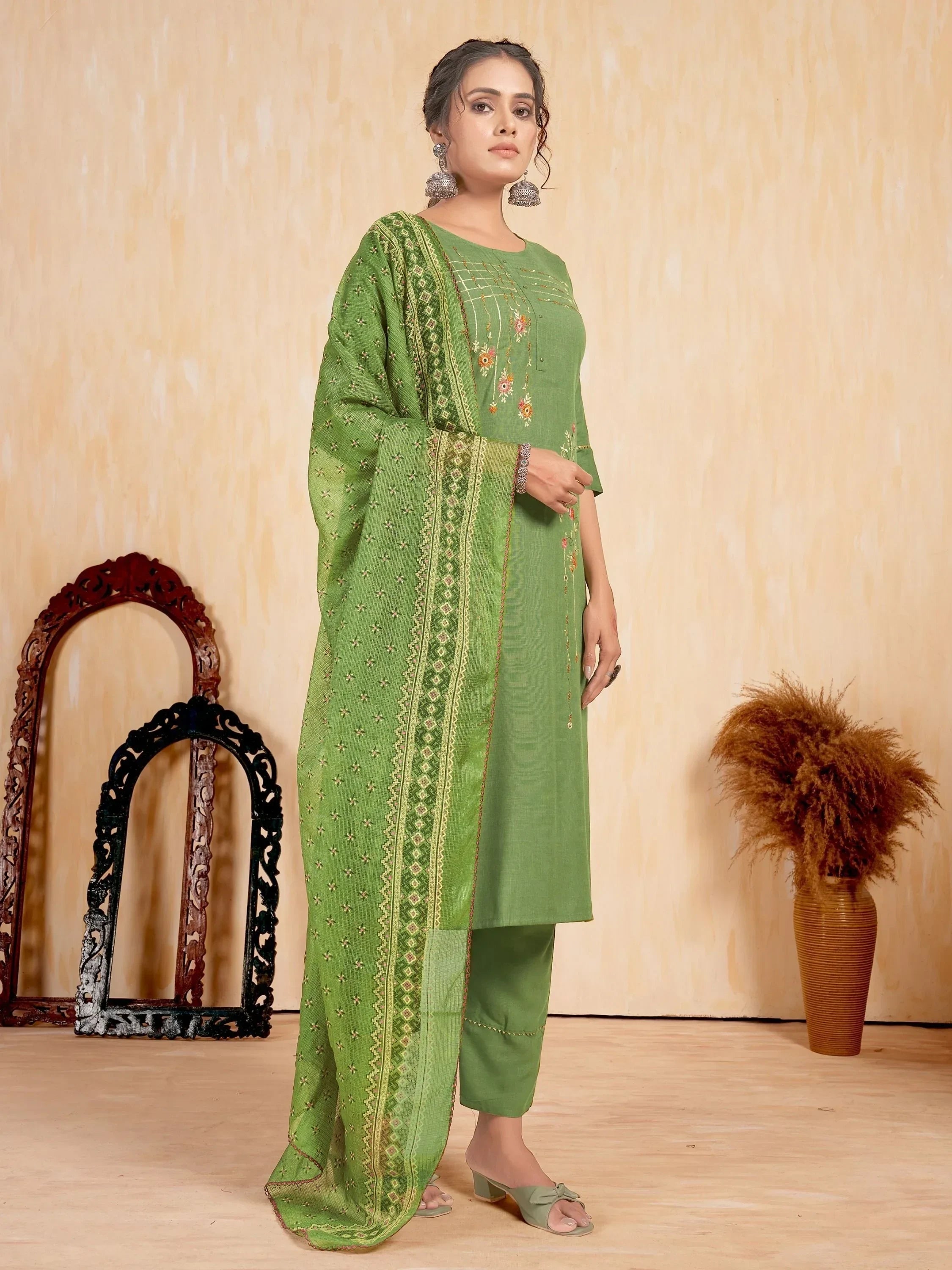 Woman in green embroidered salwar kameez with dupatta, ethnic wear fashion