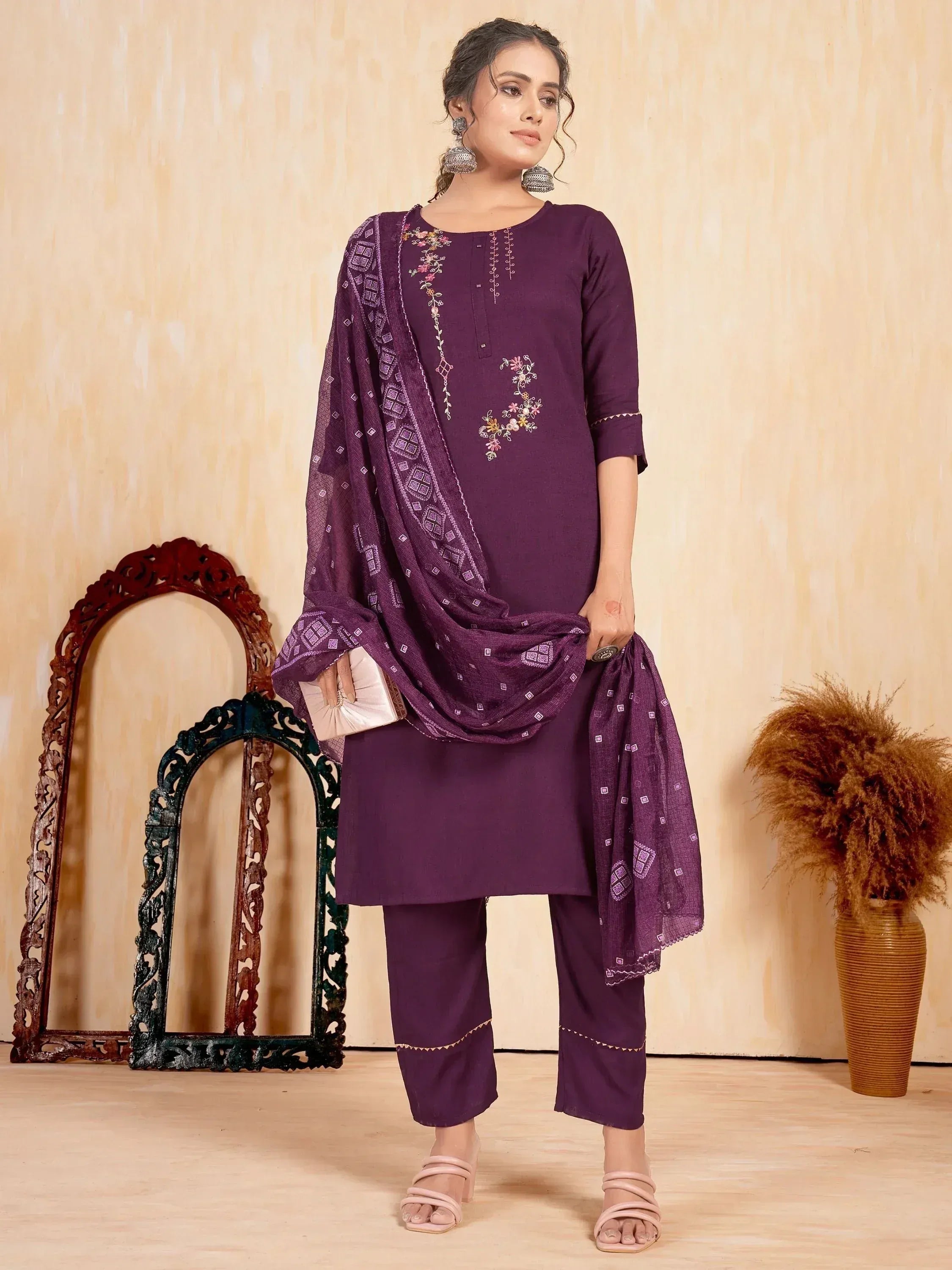 Purple embroidered salwar kameez with matching dupatta, floral detailing, and palazzo pants for ethnic wear