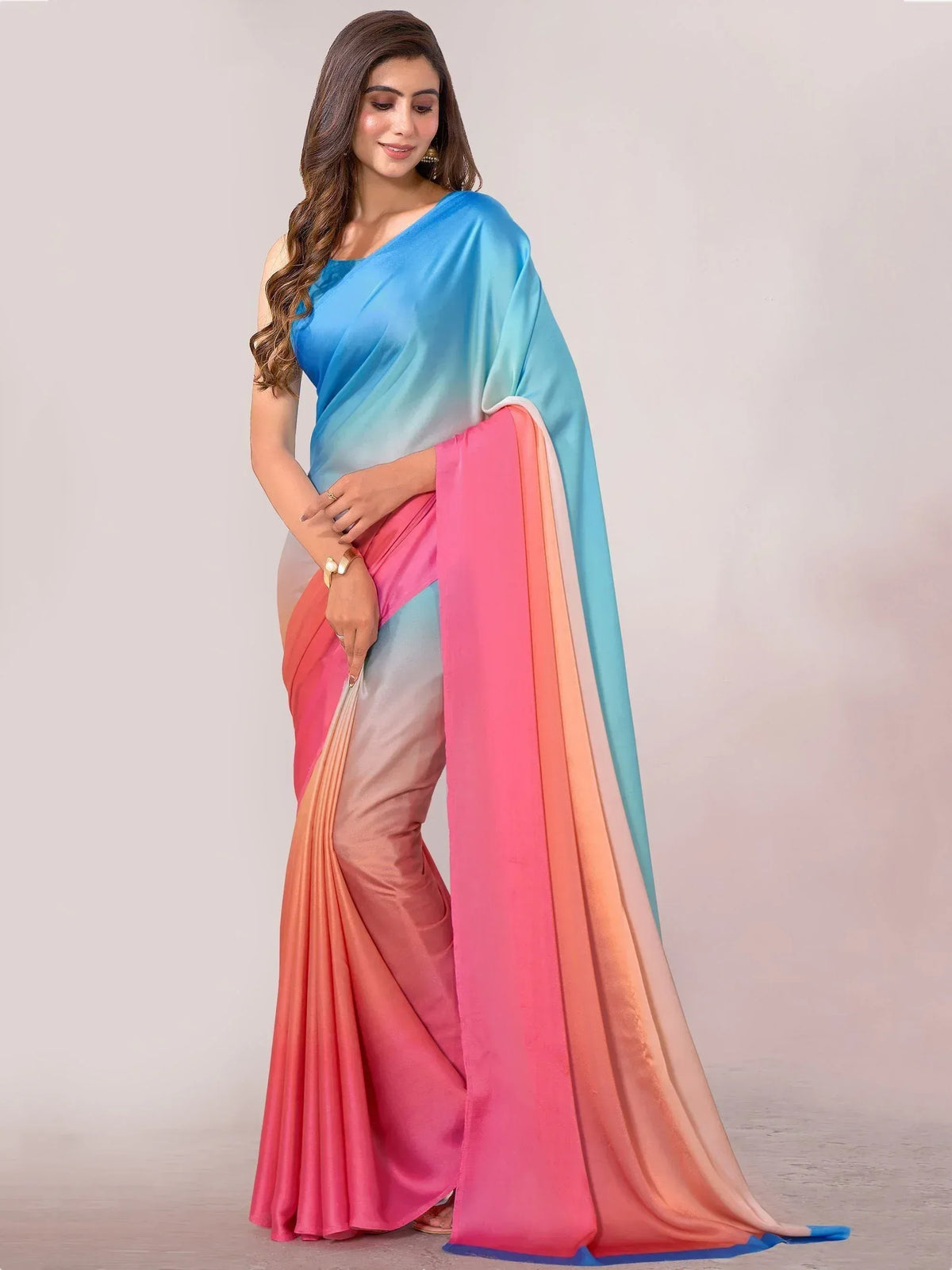 Woman in vibrant ombre saree with blue to pink gradient, perfect for Indian ethnic wear occasions