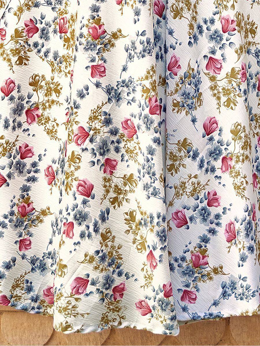 Floral printed ethnic gown with pink, blue, and gold blooms on cream fabric
