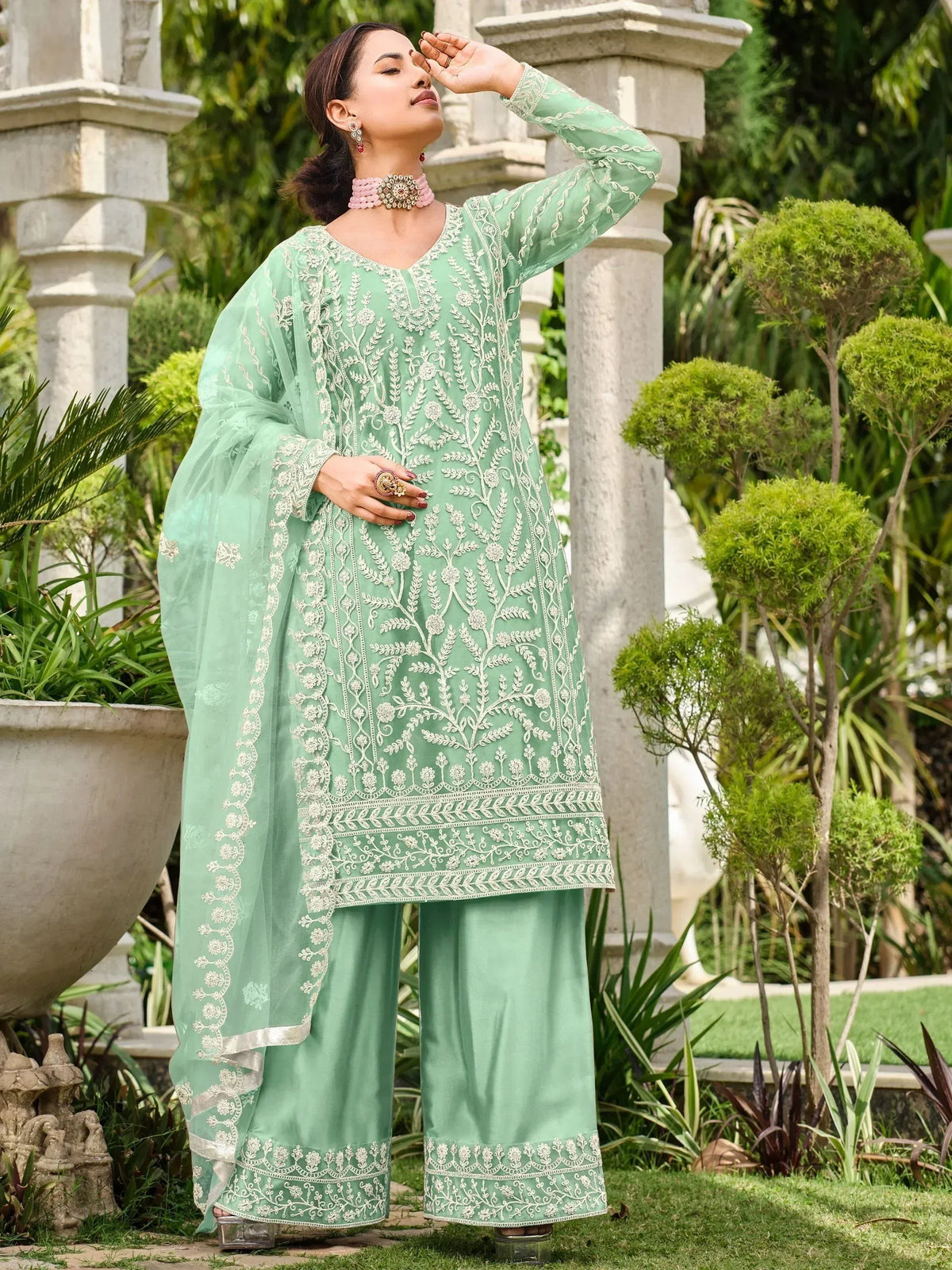 Mint green embroidered salwar kameez with floral detailing, perfect for Indian ethnic wear occasions