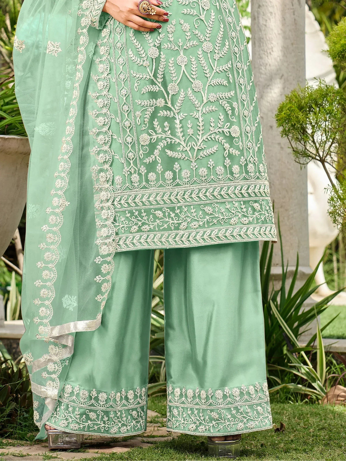 Mint green embroidered salwar kameez with floral detailing, perfect for ethnic wear occasions.