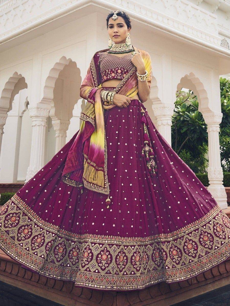 Elegant maroon lehenga choli with gold embroidery, perfect for Indian weddings and festive occasions.