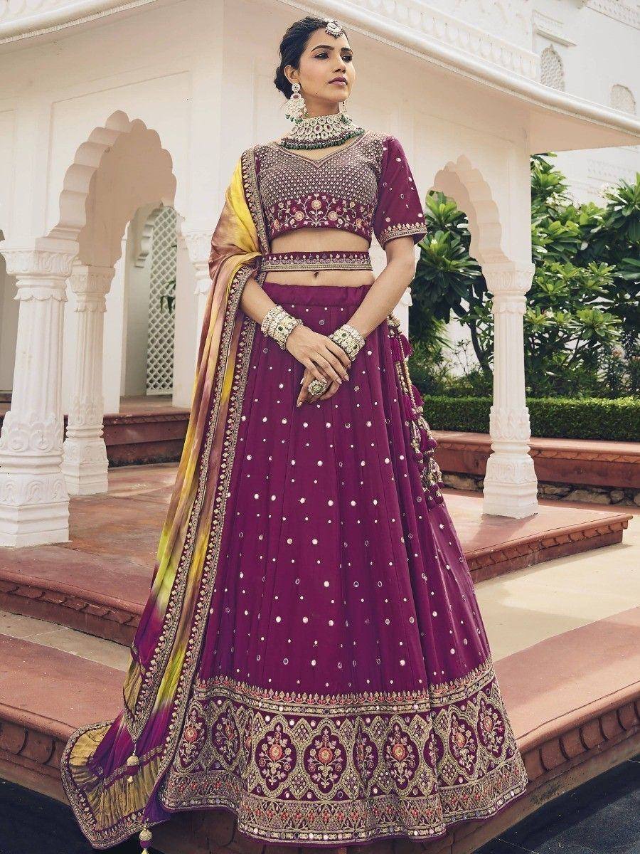 Elegant maroon lehenga choli with intricate embroidery, perfect for Indian weddings and festive occasions.