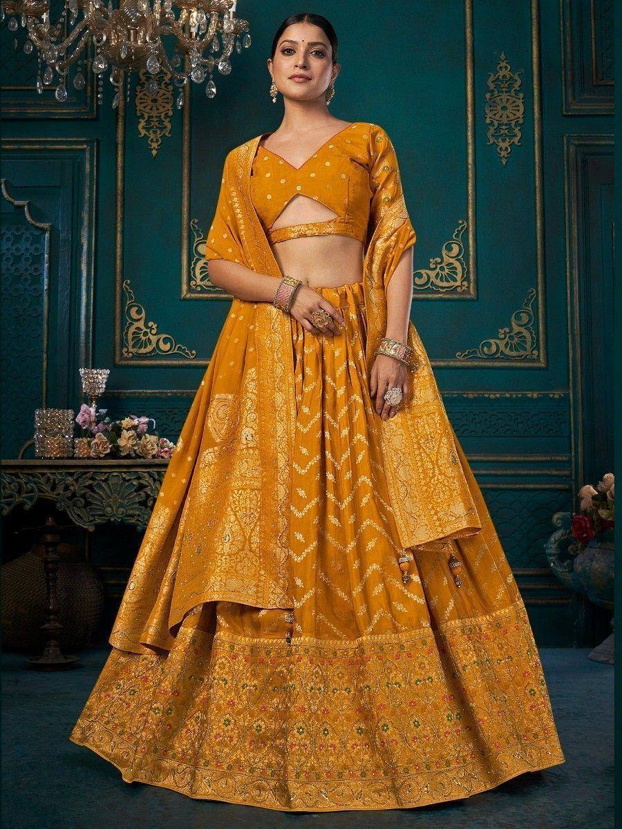 Mustard yellow designer lehenga choli with gold embroidery, perfect for Indian weddings and festive occasions