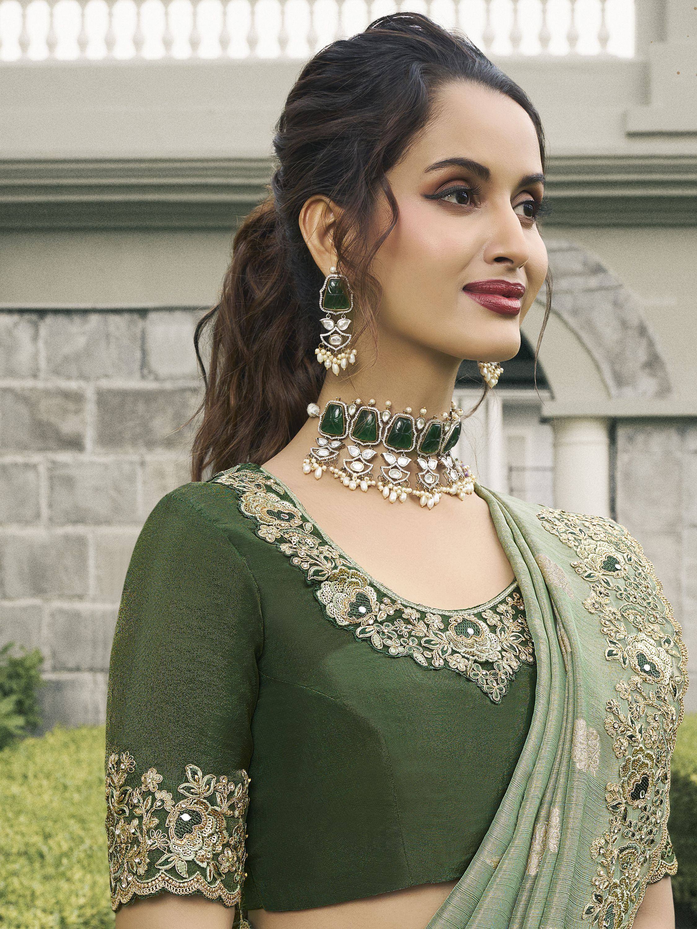 Elegant green embroidered saree with matching jewelry, perfect for Indian ethnic occasions
