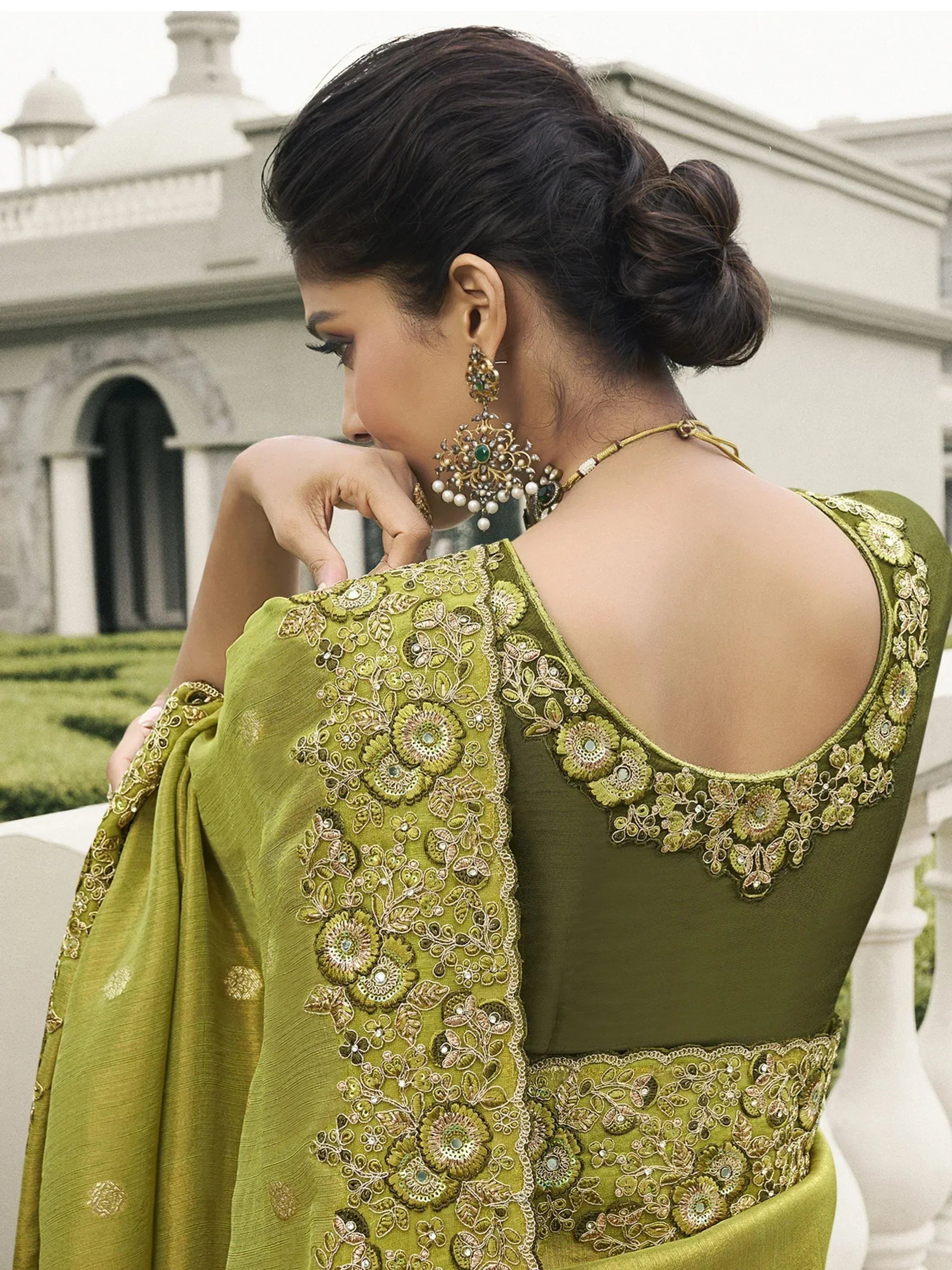 Olive green designer saree with floral embroidery and backless blouse, perfect for Indian ethnic wear occasions