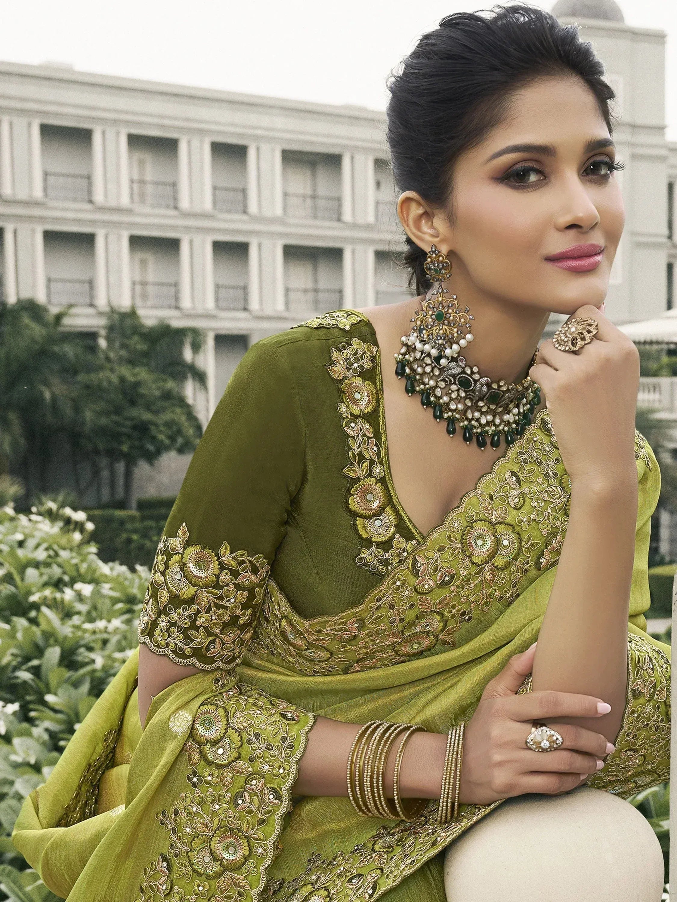 Olive green designer saree with floral embroidery, perfect for Indian ethnic wear occasions.