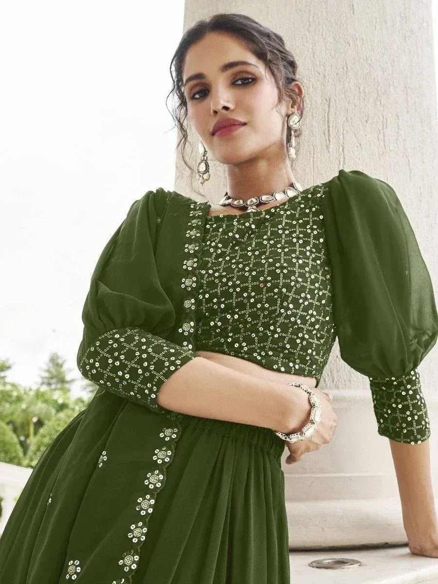 Green embroidered ethnic gown with puff sleeves, perfect for Indian occasions and festive wear.