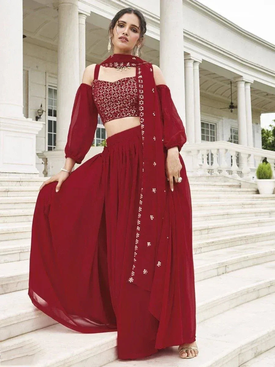 Maroon ethnic lehenga choli with floral embroidery, off-shoulder blouse, and dupatta, perfect for weddings or parties.