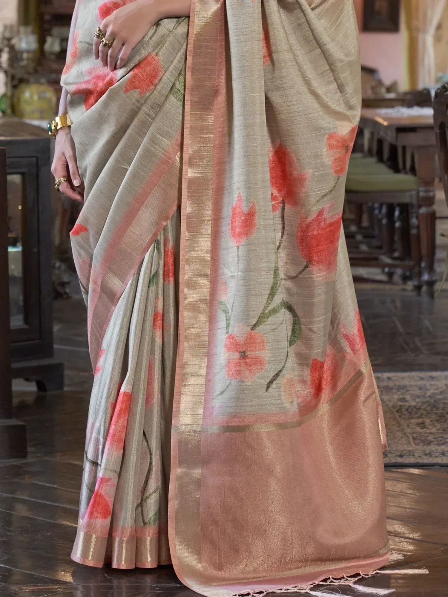 Beige saree with coral floral print and pink border, elegant Indian ethnic wear