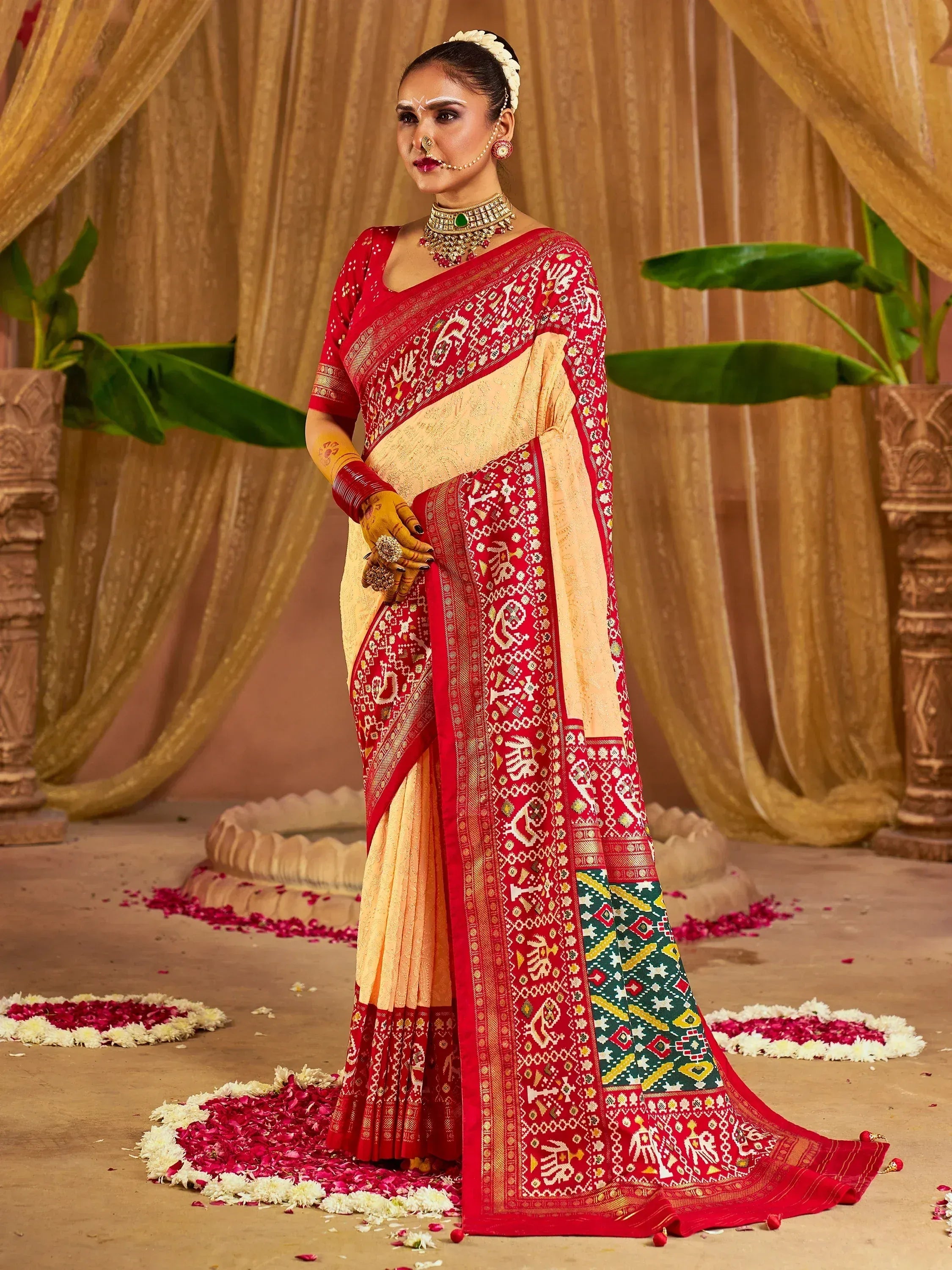 Red and cream designer saree with intricate embroidery, perfect for Indian weddings and ethnic occasions.