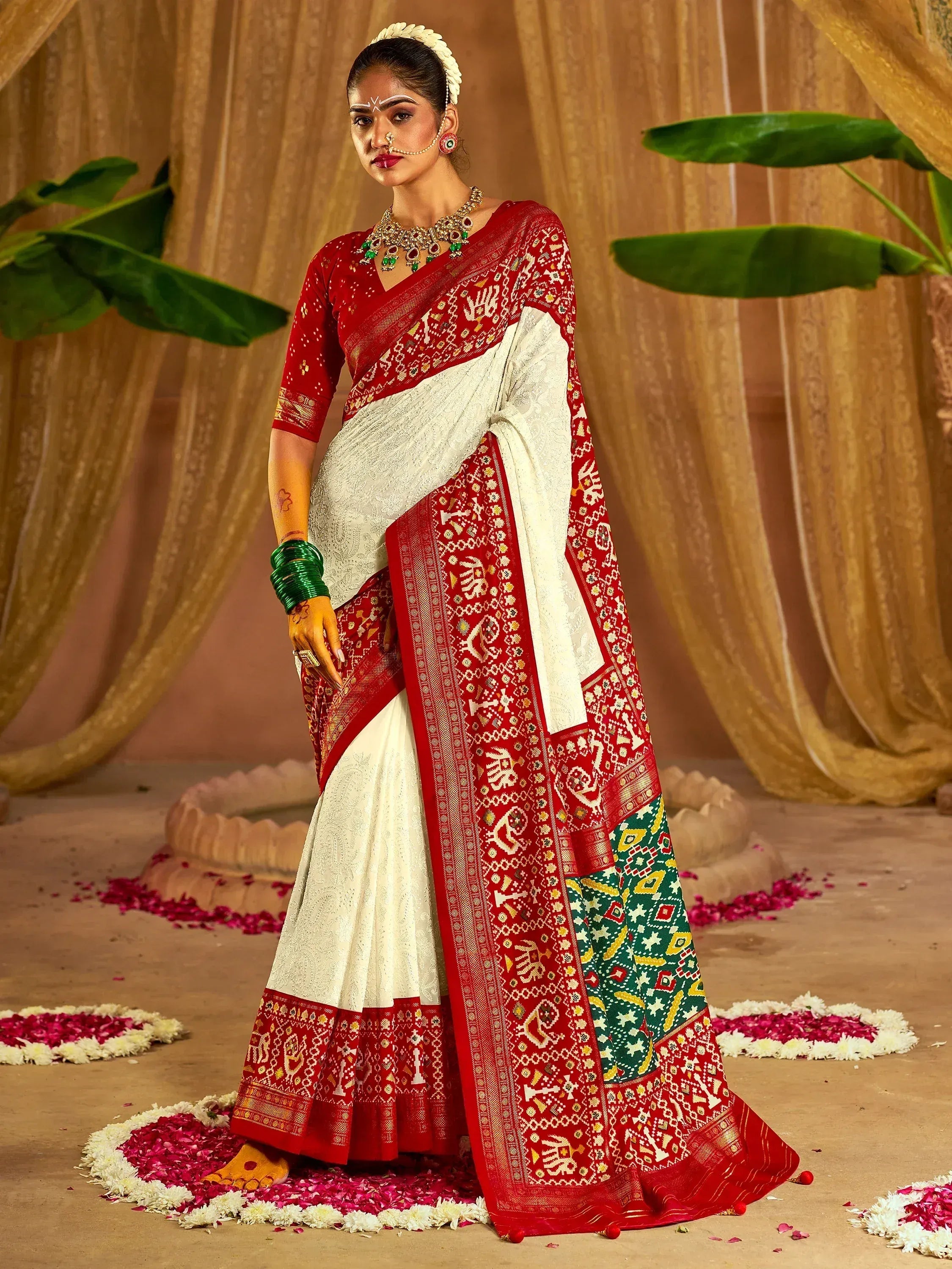Red and white ethnic saree with intricate patterns, perfect for Indian weddings and festive occasions