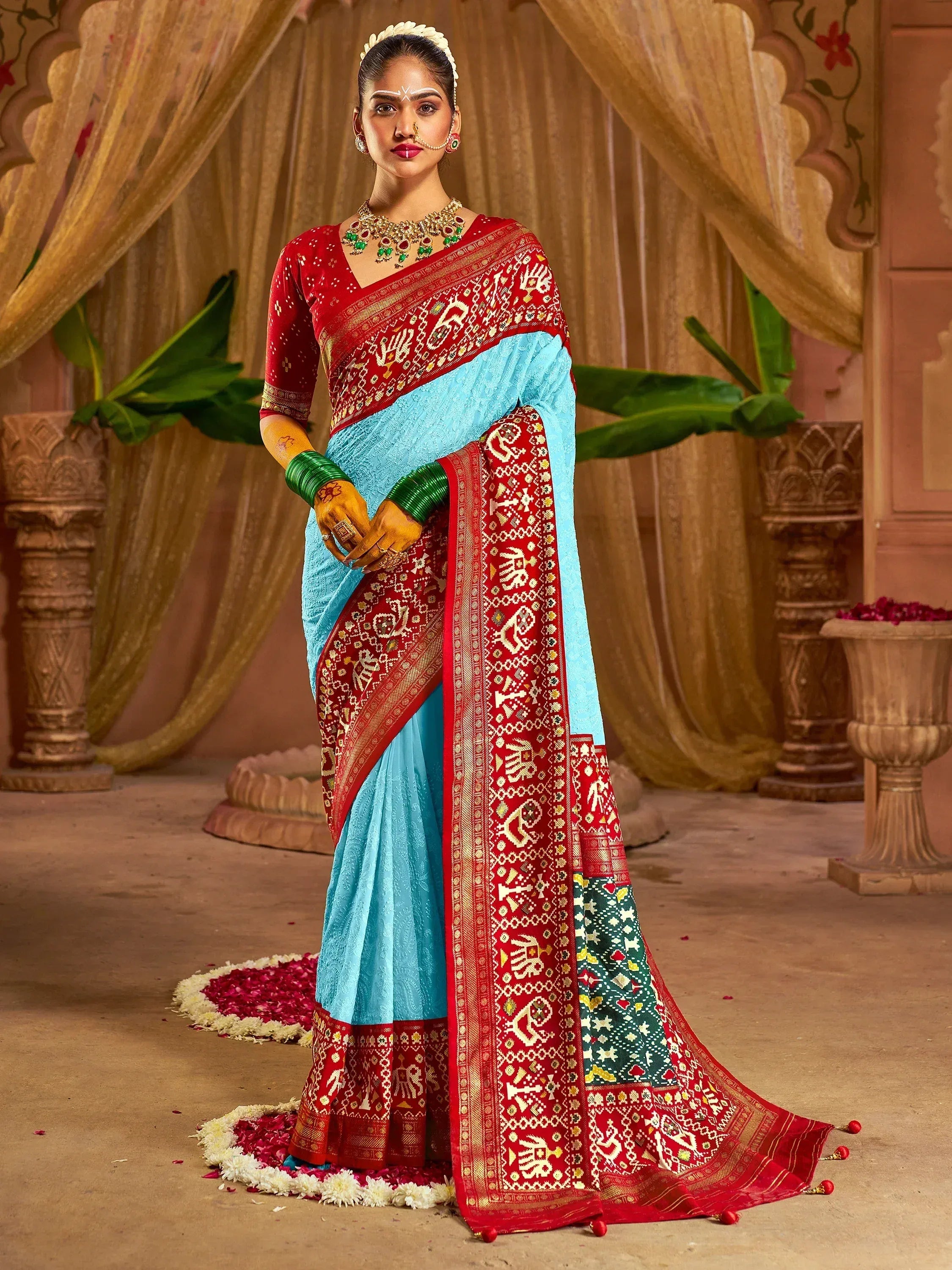Blue and red ethnic saree with intricate gold embroidery, perfect for Indian weddings and festive occasions