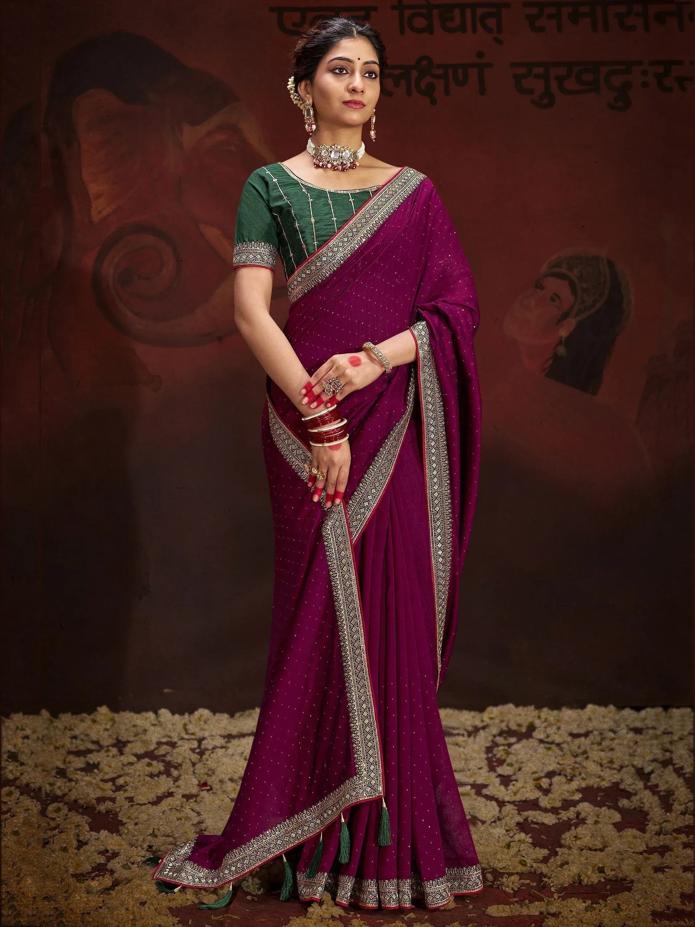 Elegant purple saree with gold border and green blouse, traditional Indian ethnic wear for women