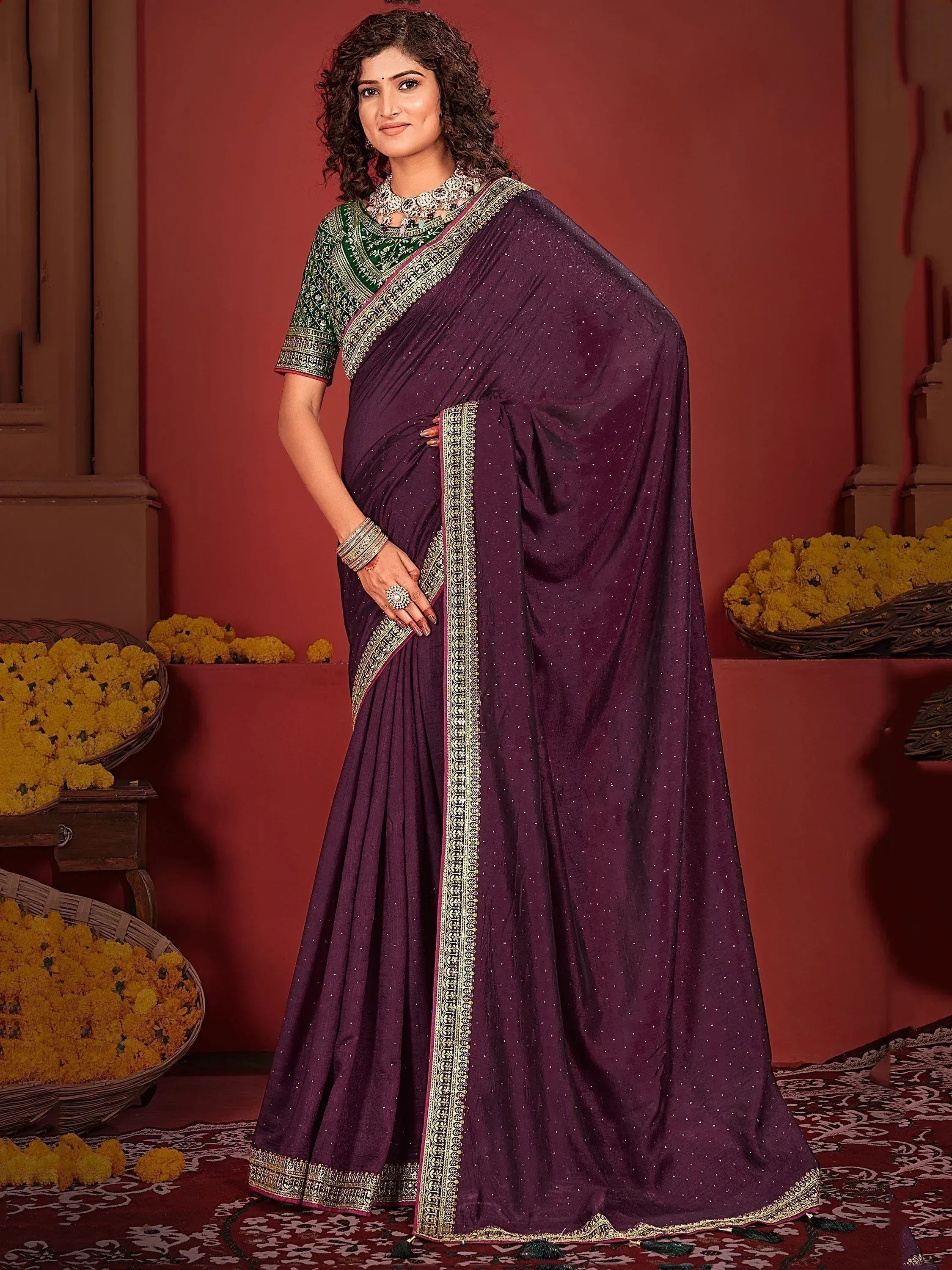 Elegant purple saree with gold embroidery and green blouse, perfect for Indian ethnic occasions