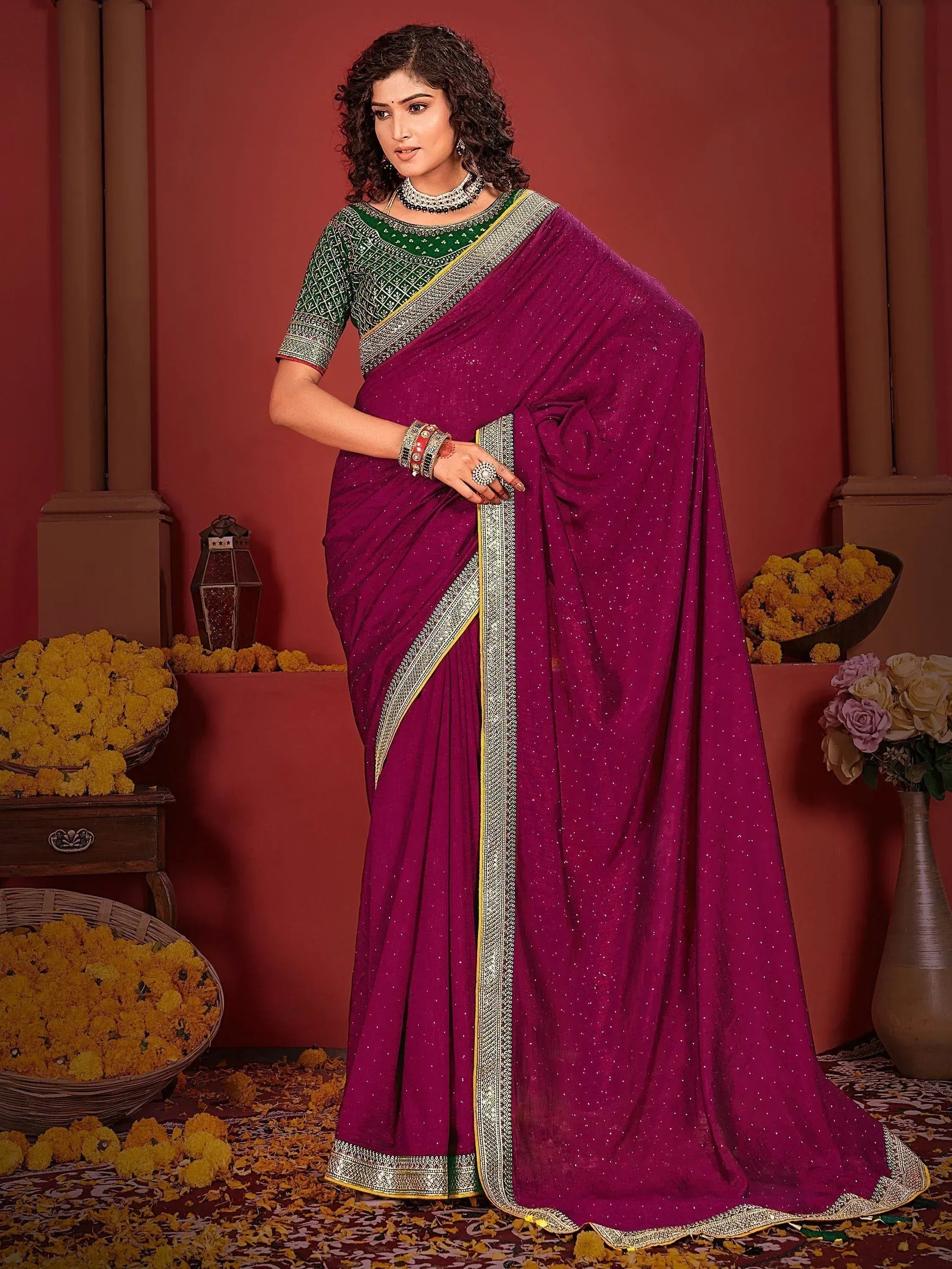 Purple ethnic saree with green blouse, gold border, and sequin detailing for Indian occasions