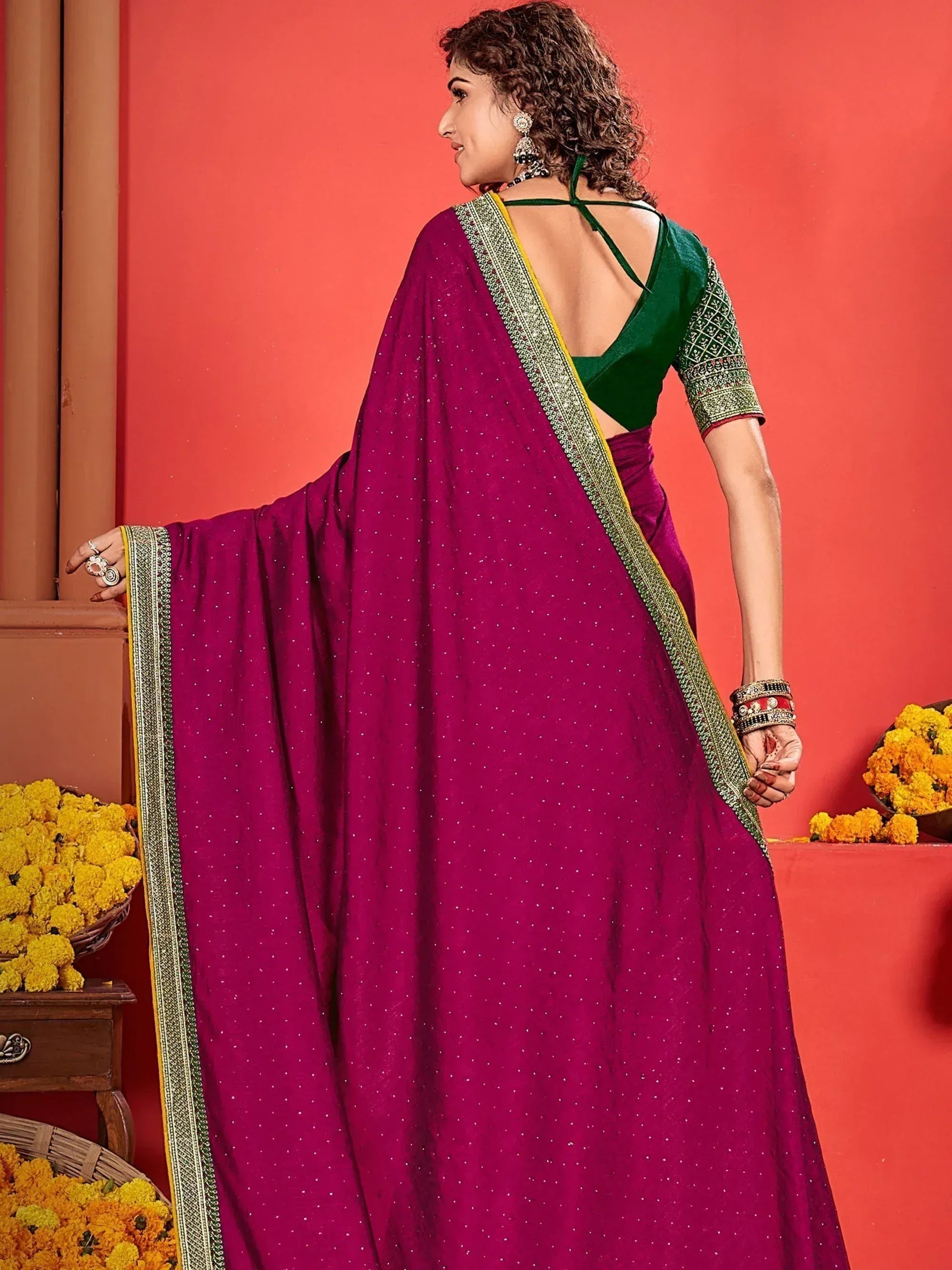 Woman in magenta saree with green blouse, ethnic wear for festive occasions