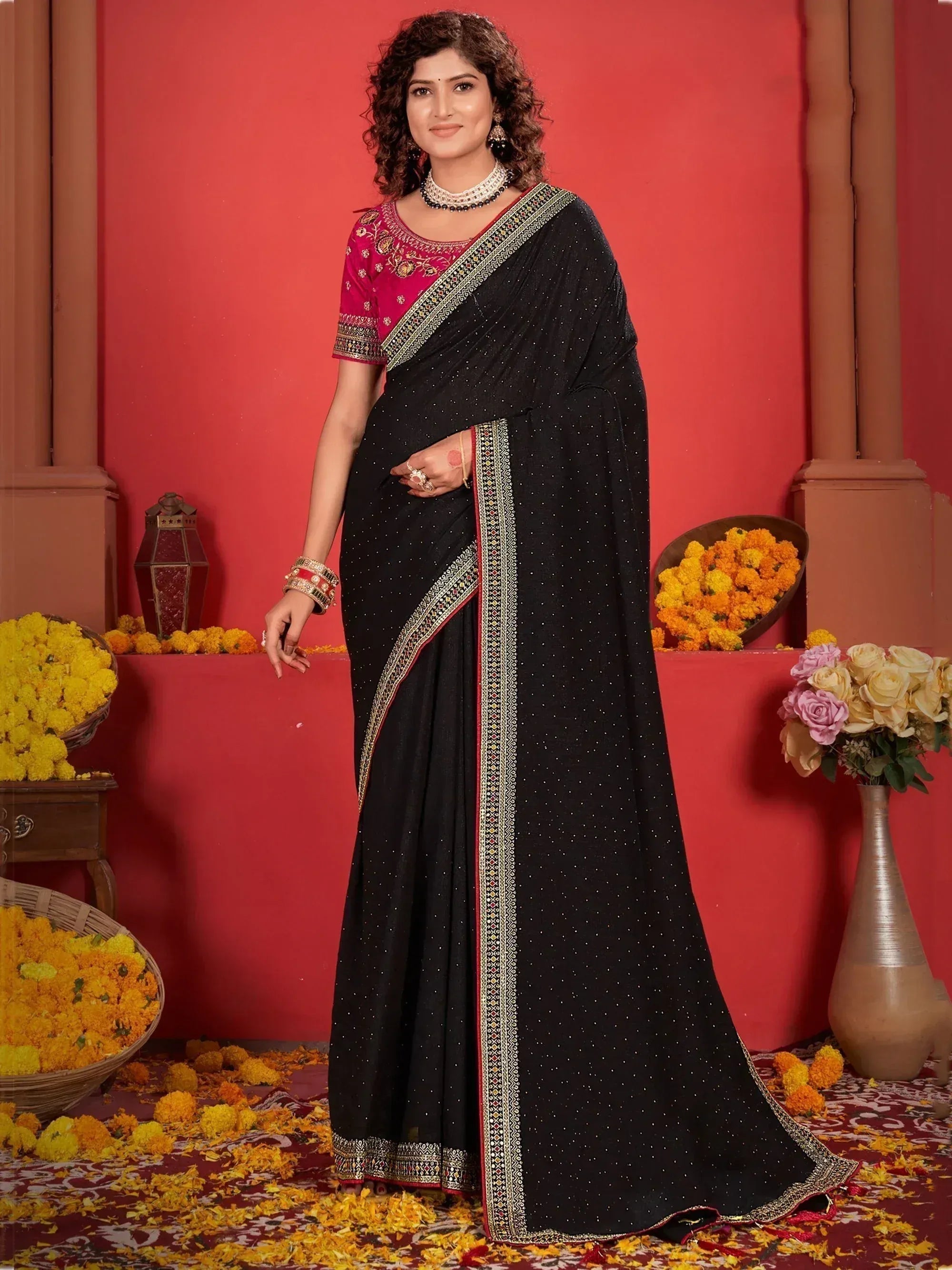 Black embroidered saree with pink blouse, perfect for Indian ethnic occasions and festive wear.