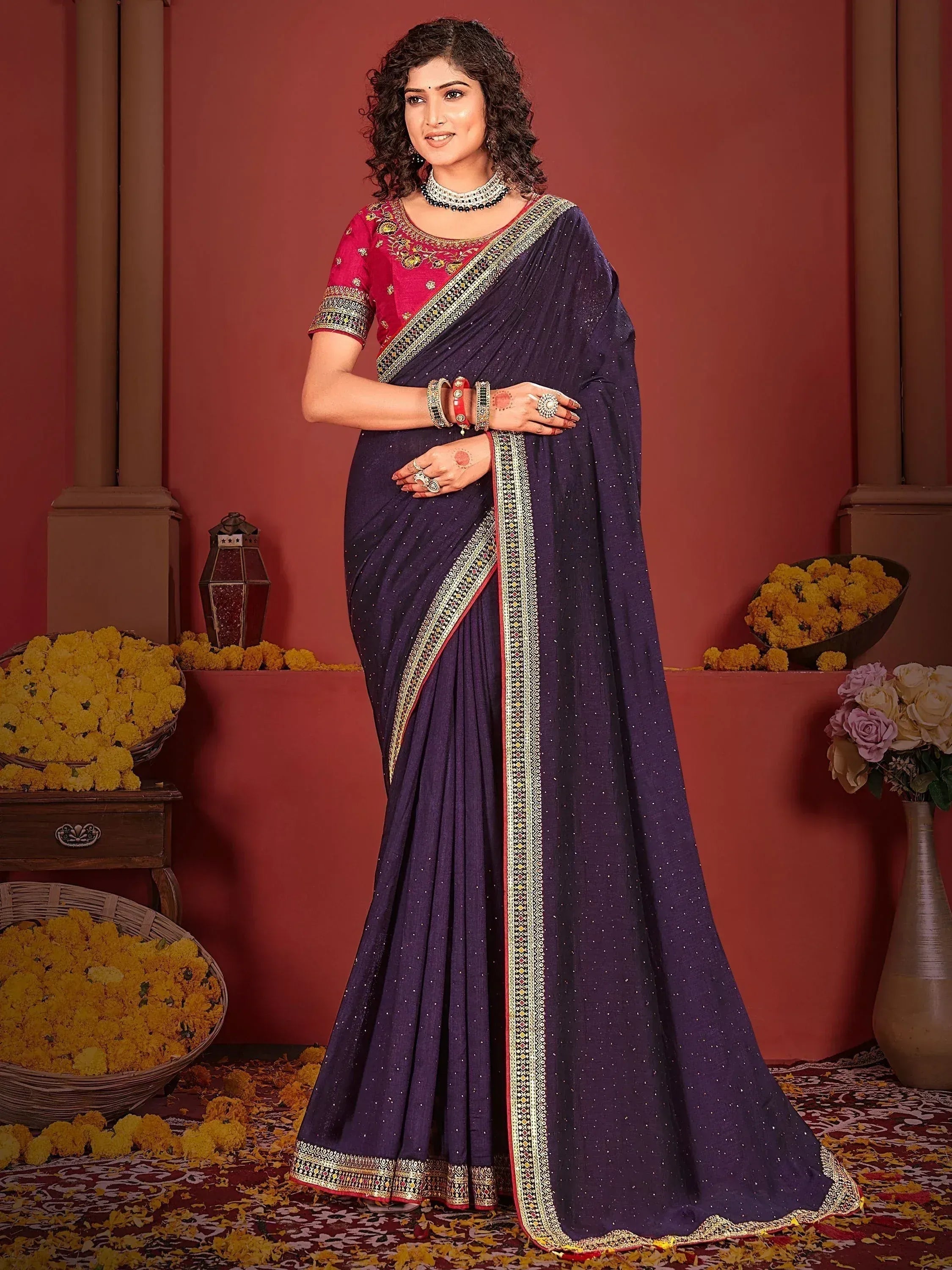 Elegant purple saree with gold border and red blouse, perfect for Indian ethnic occasions