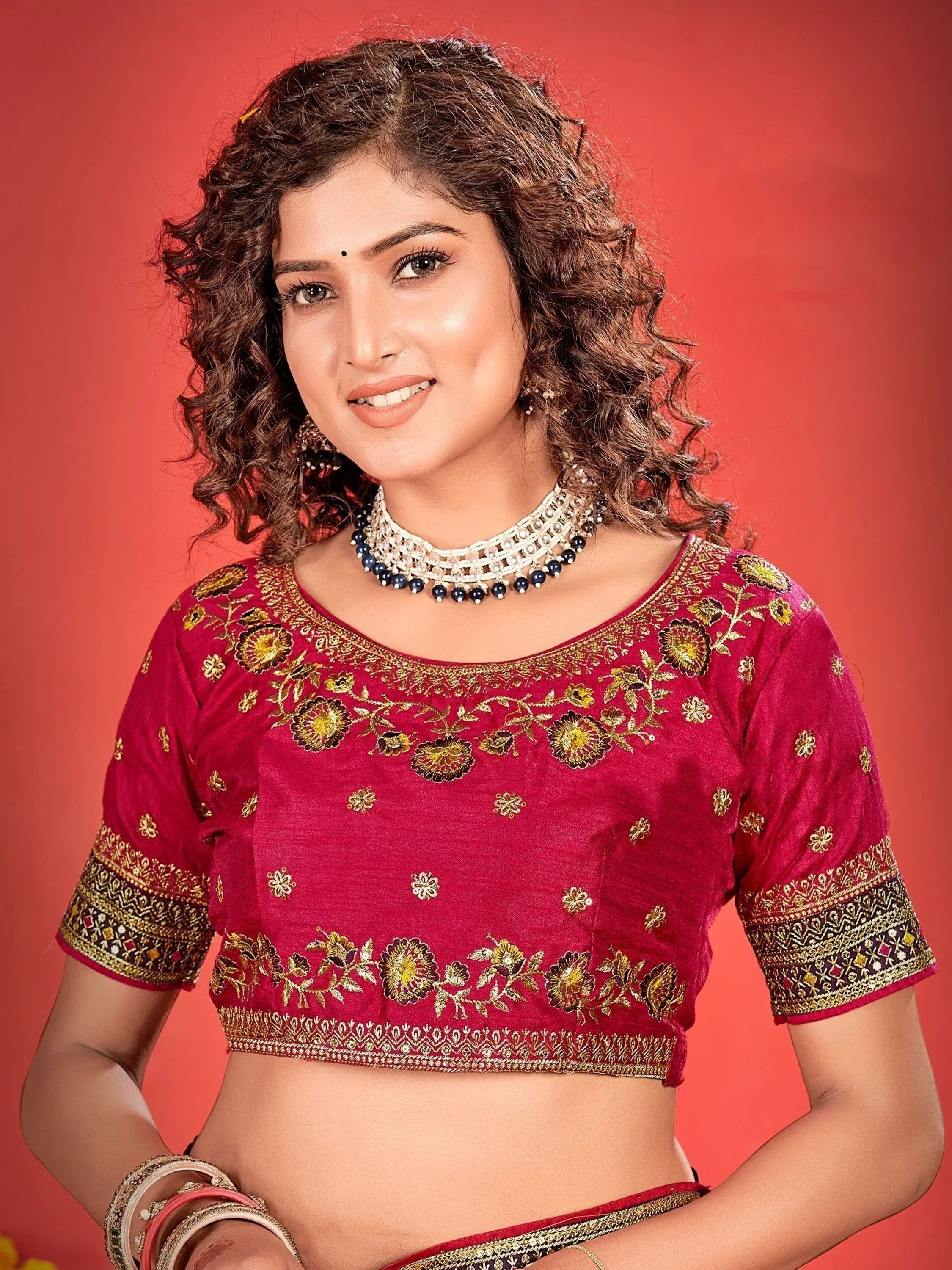 Red embroidered designer blouse with gold floral work, perfect for Indian ethnic wear and lehenga choli sets