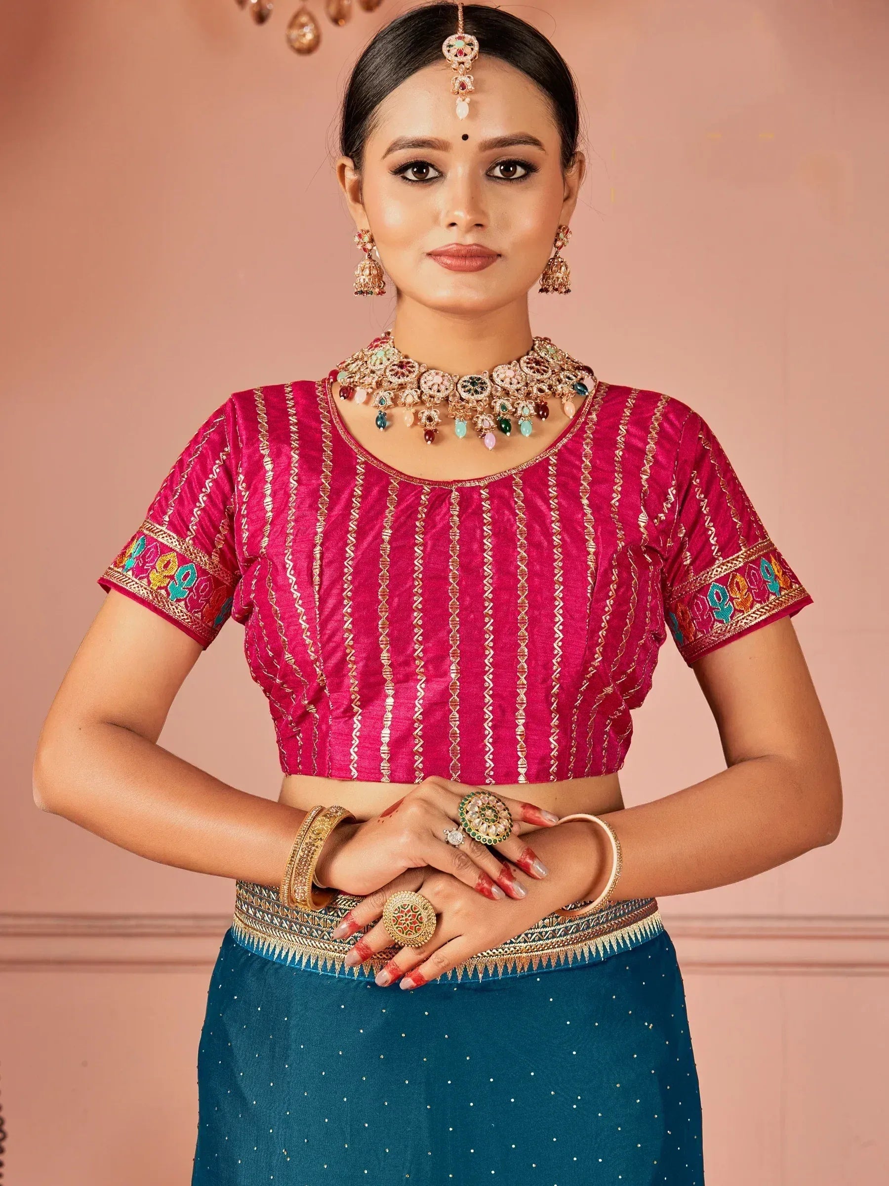 Pink embroidered blouse with blue skirt, traditional Indian ethnic wear, designer jewelry