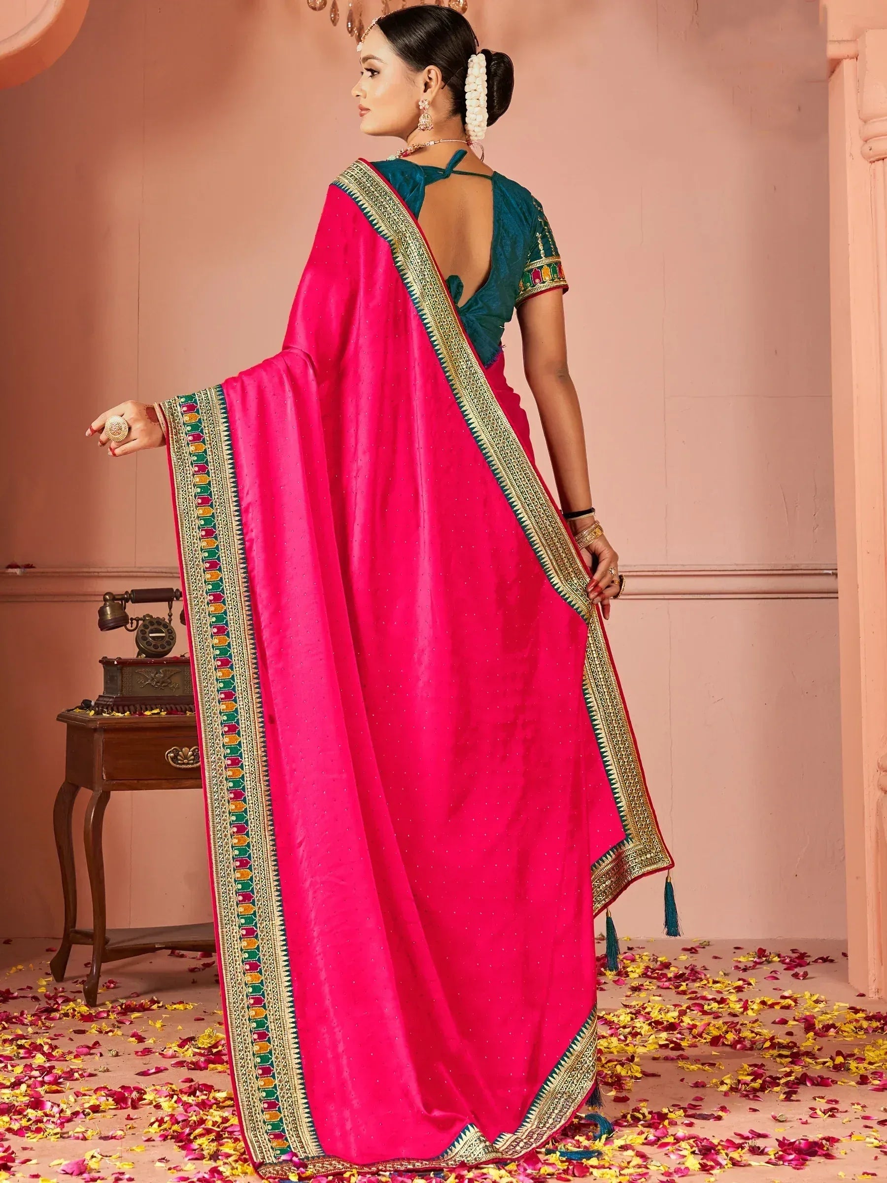 Pink designer saree with gold border and teal blouse, ethnic Indian wear for women
