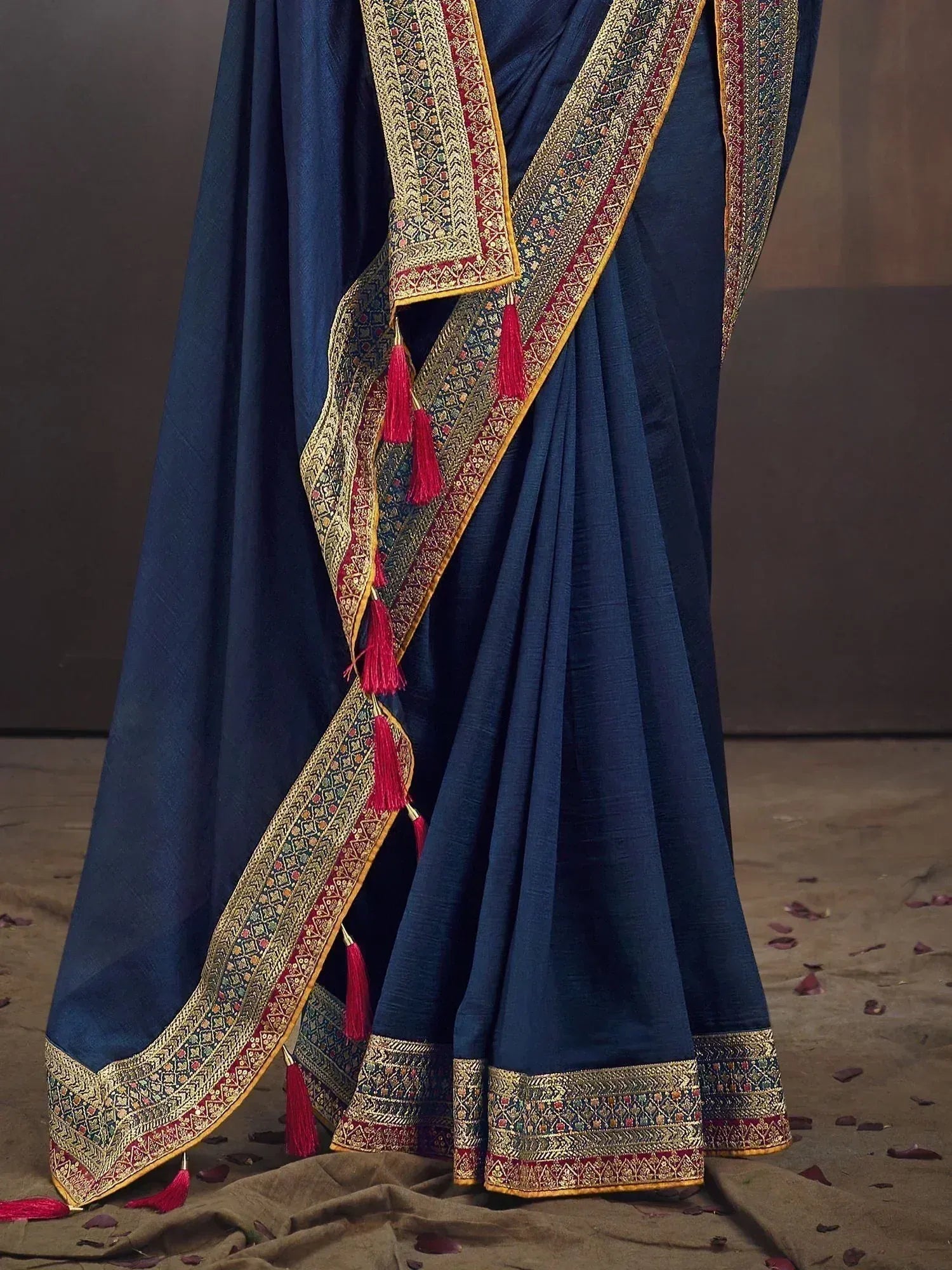 Navy blue designer saree with gold and red zari border and tassels, ethnic wear for women