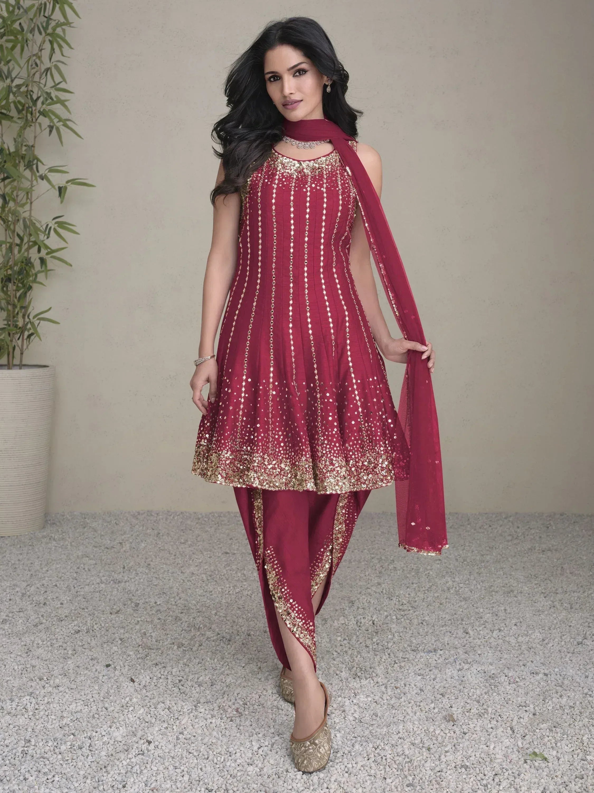 Maroon Indian ethnic wear with gold sequin embroidery, dhoti pants, and dupatta for festive occasions