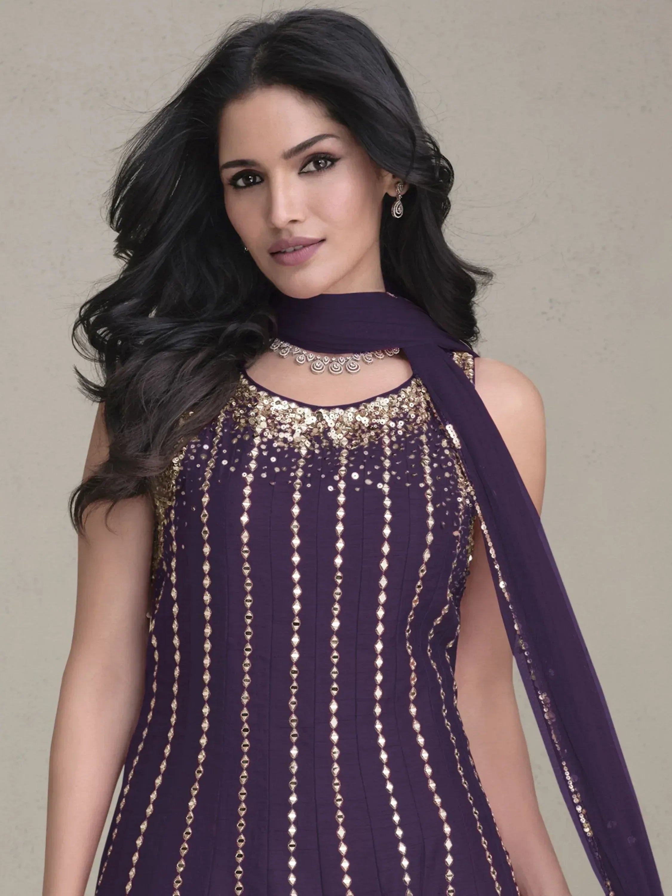 Purple ethnic gown with gold sequin embroidery and matching dupatta, perfect for Indian occasions