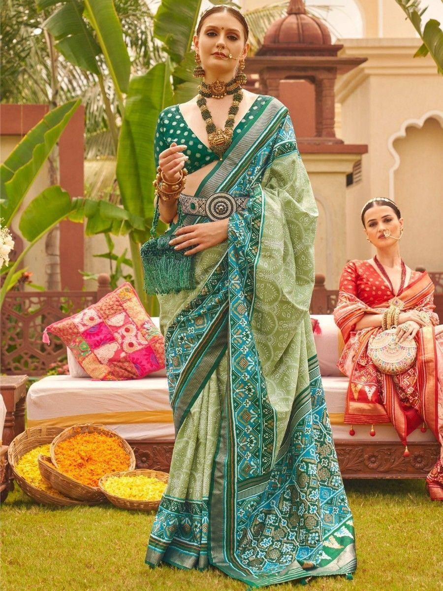 Green printed saree with gold jewelry, perfect for Indian ethnic occasions and weddings
