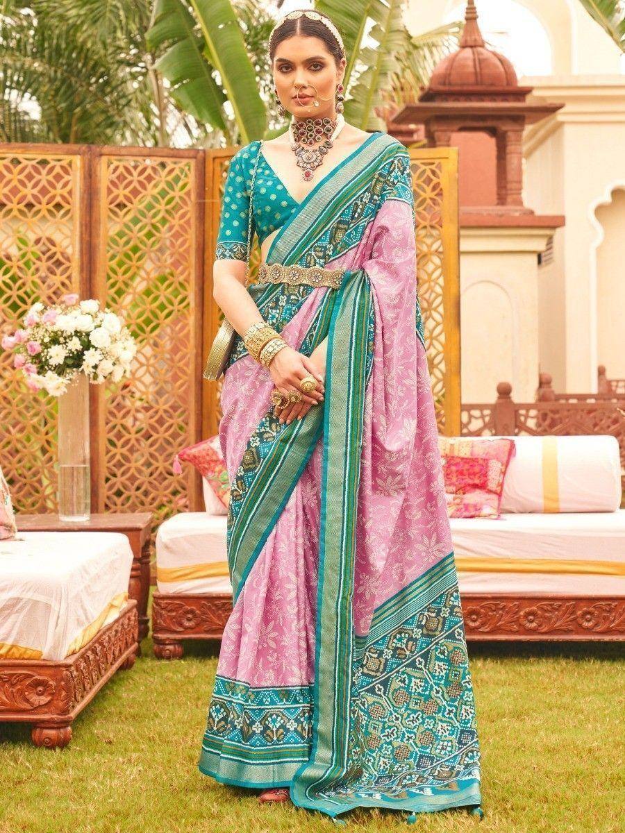 Pink and teal designer saree with intricate patterns, perfect for Indian ethnic wear occasions