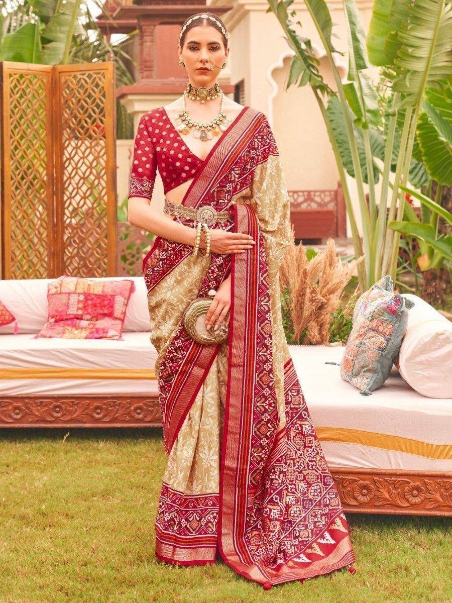 Elegant red and gold ethnic saree with intricate patterns, perfect for Indian celebrations