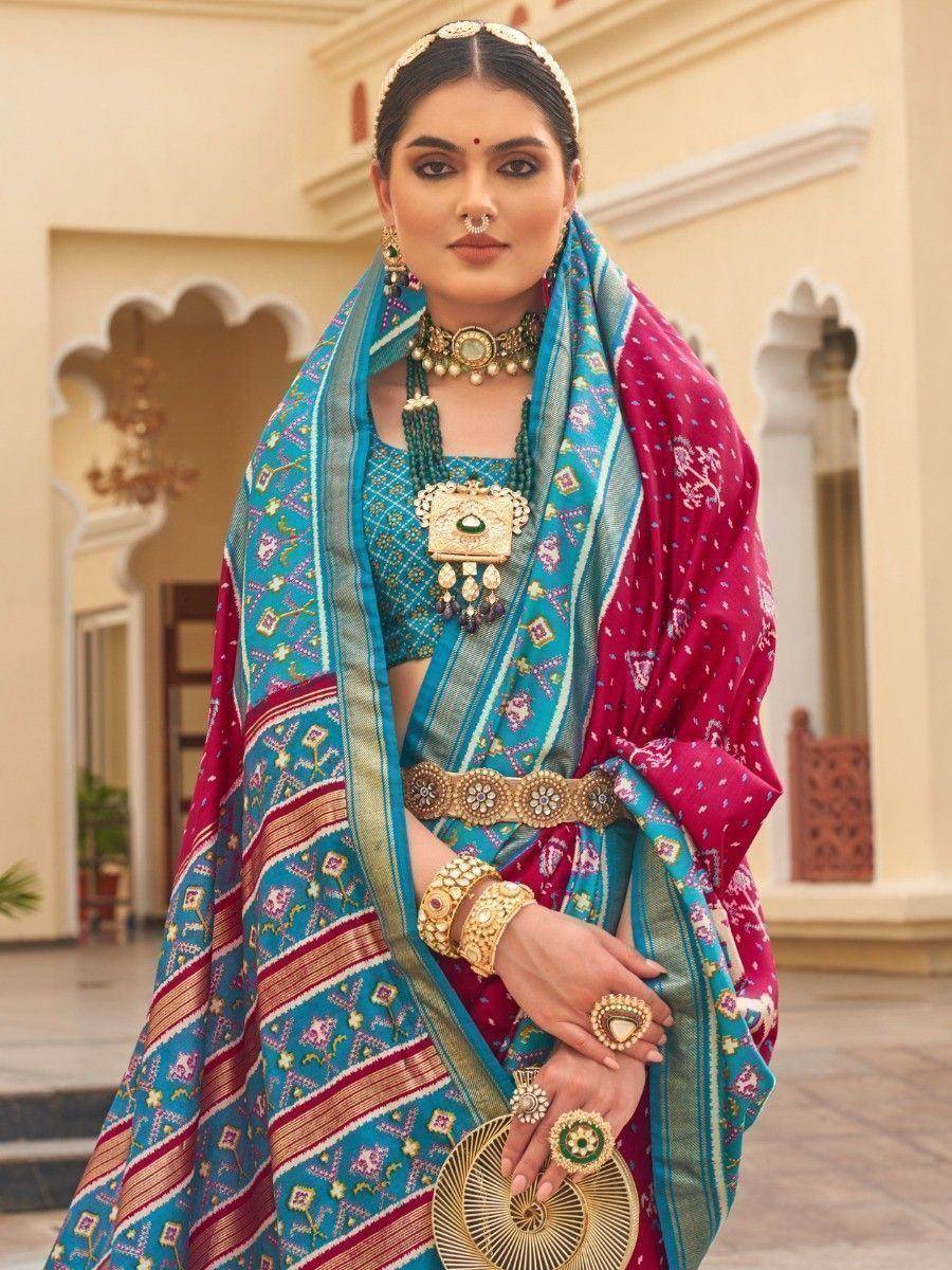 Indian ethnic wear: turquoise and pink printed lehenga choli with gold jewelry, traditional bridal outfit