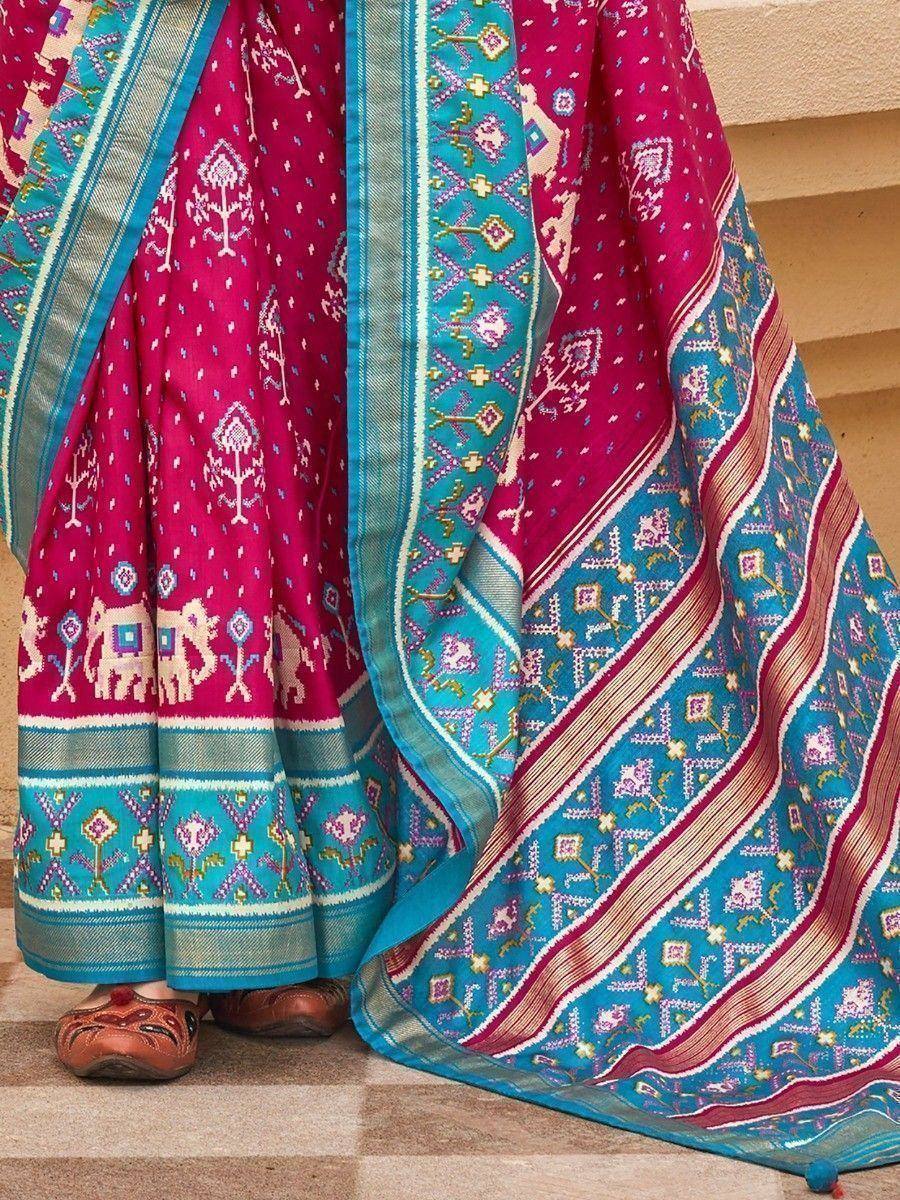 Pink and turquoise ethnic lehenga with elephant print and woven border, perfect for Indian weddings or festivals