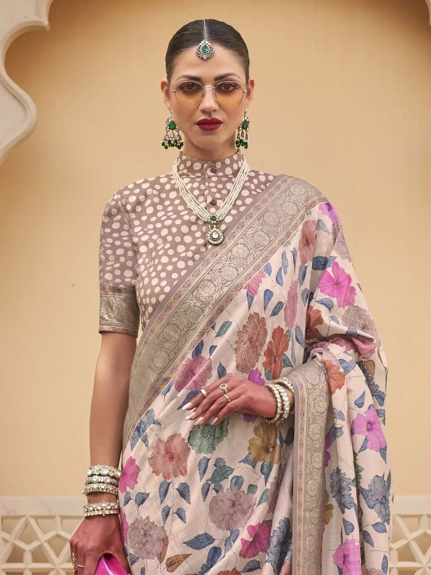 Floral print saree with polka dot blouse, traditional Indian ethnic wear, adorned with jewelry