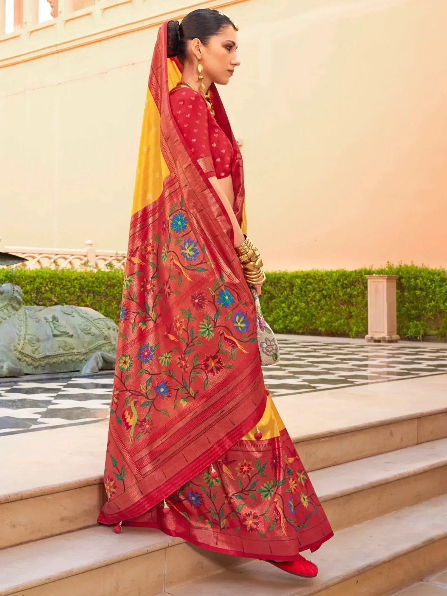 Red and yellow embroidered saree with floral motifs, perfect for Indian ethnic wear occasions