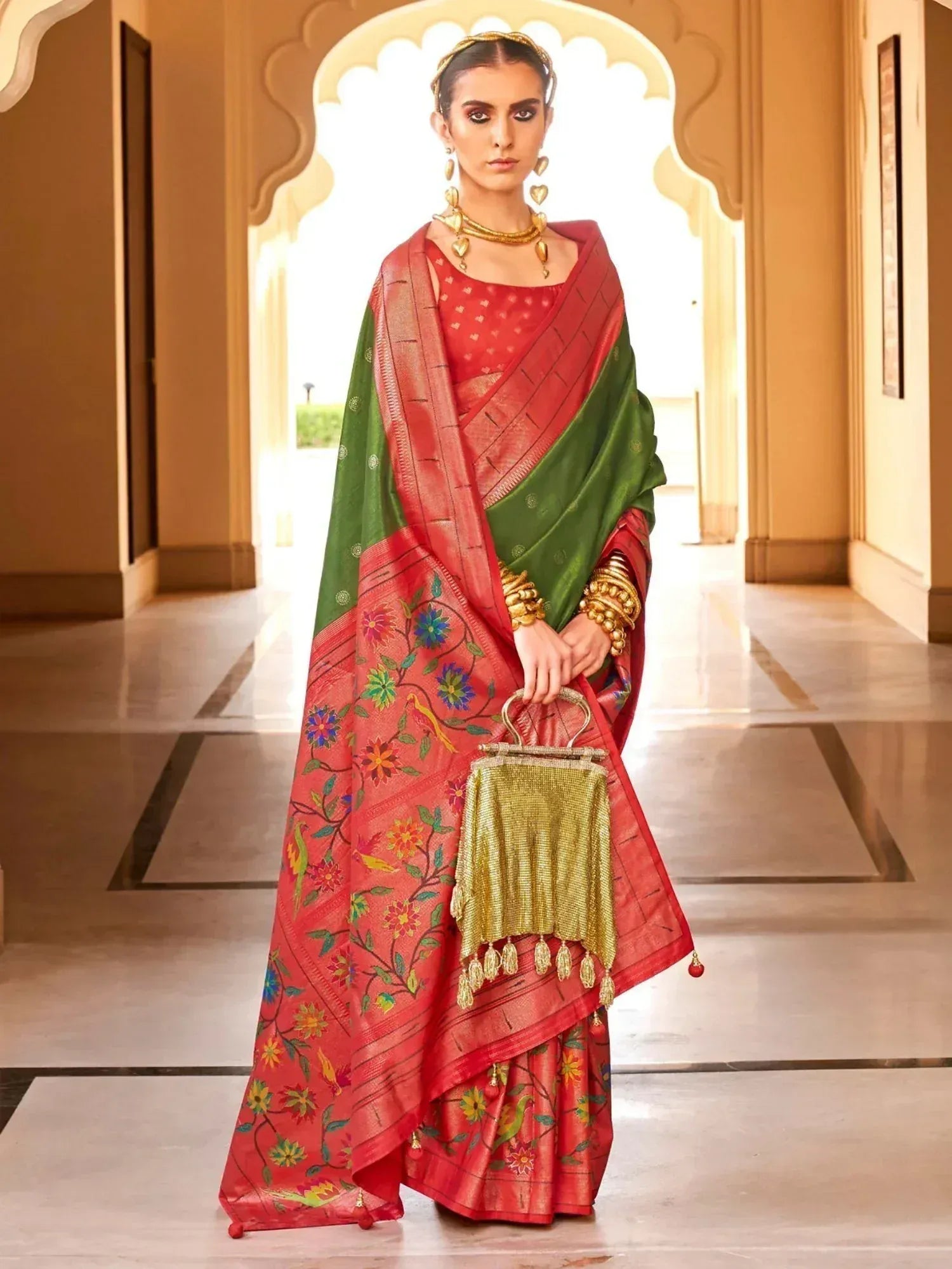 Red and green floral embroidered saree with gold jewelry, perfect for Indian ethnic wear occasions