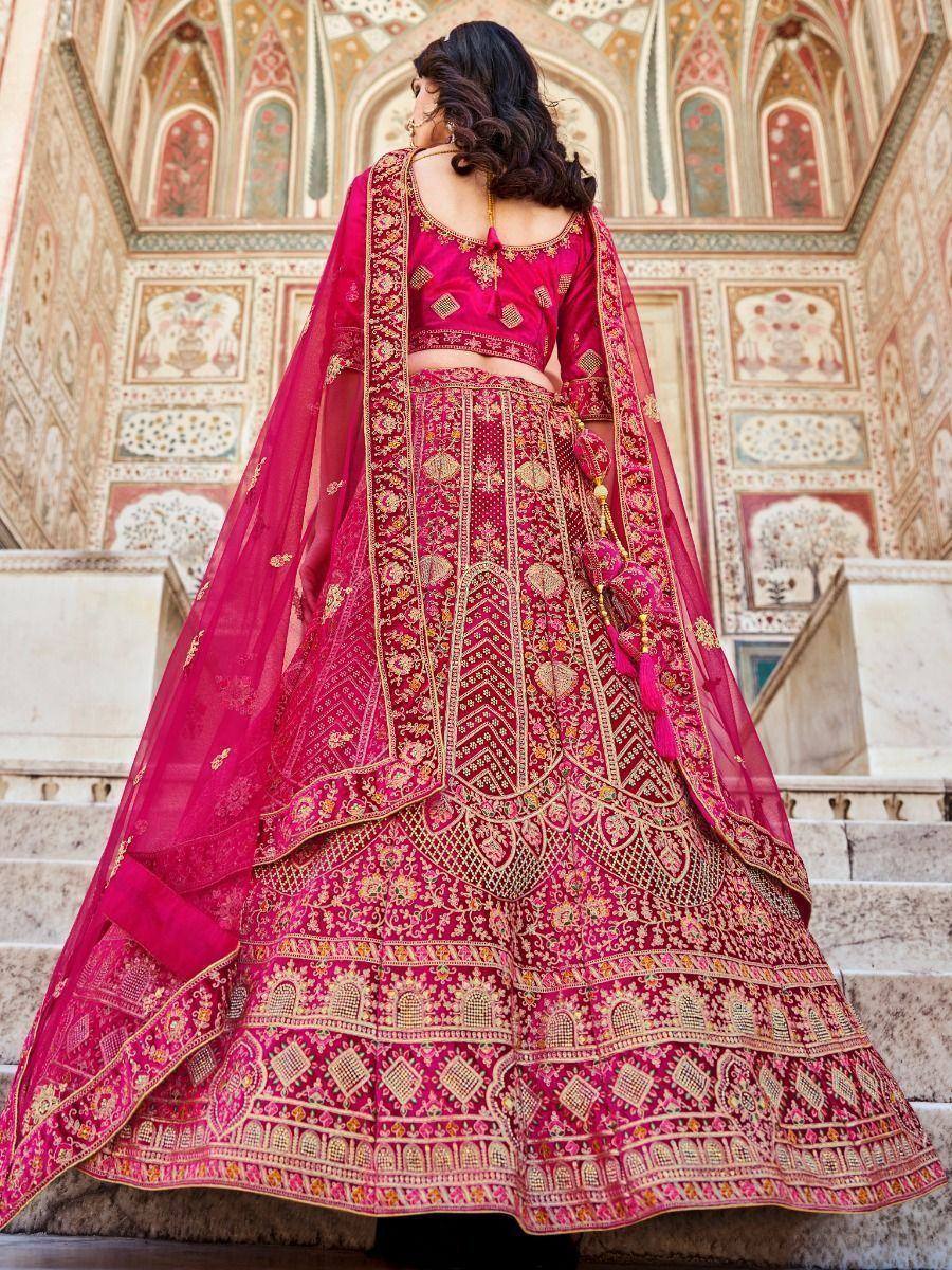 Pink embroidered lehenga choli with gold detailing, perfect for Indian weddings and festive occasions.