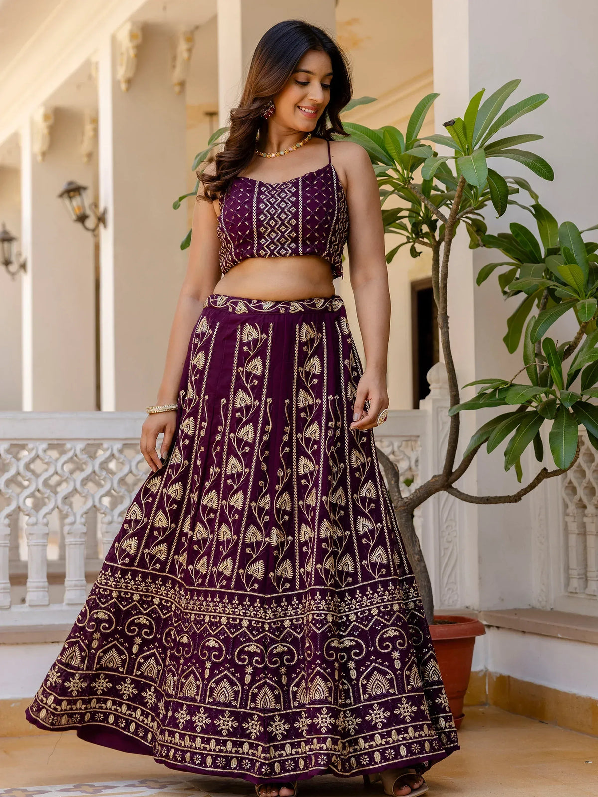 Purple embroidered lehenga choli with gold detailing, perfect for Indian ethnic wear and festive occasions.