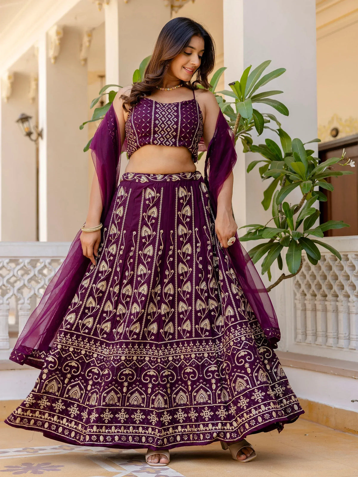 Purple embroidered lehenga choli with gold detailing, perfect for Indian ethnic wear and festive occasions.