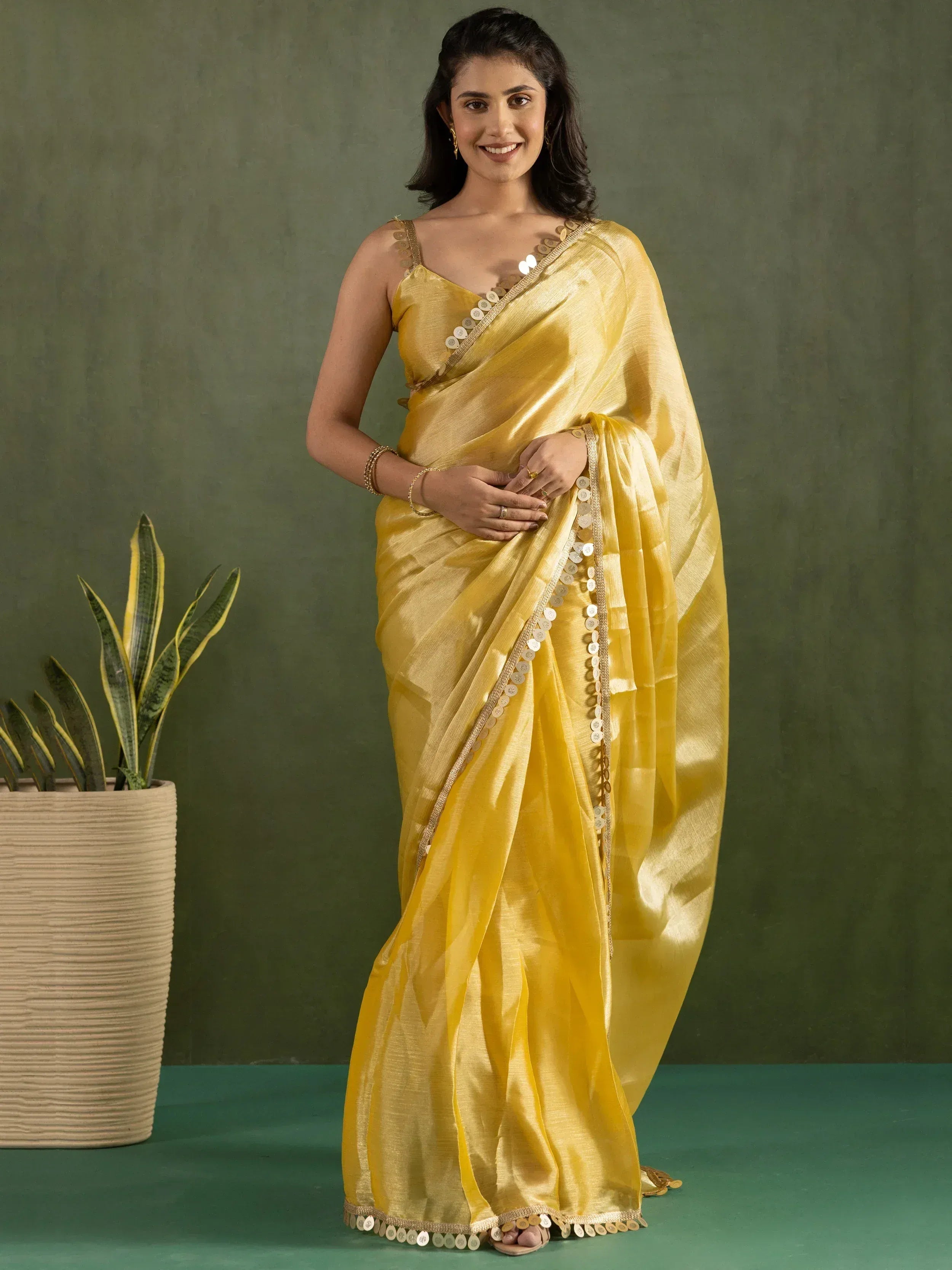 Yellow ethnic saree with coin detailing, perfect for Indian occasions and festive wear